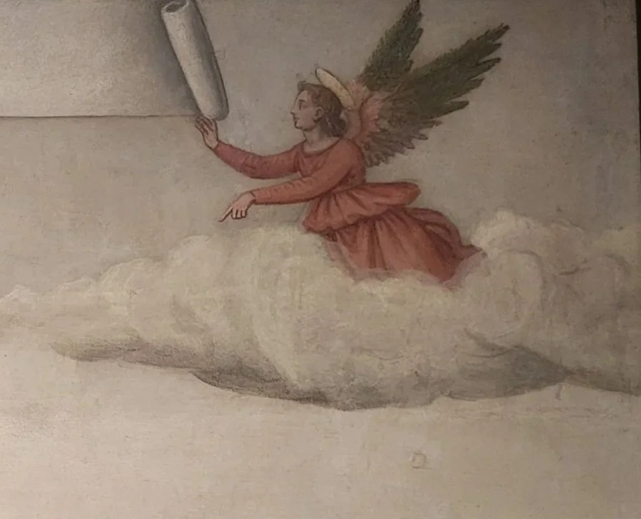 Winged angel in profile wearing red robe above clouds holds a scroll and points downward