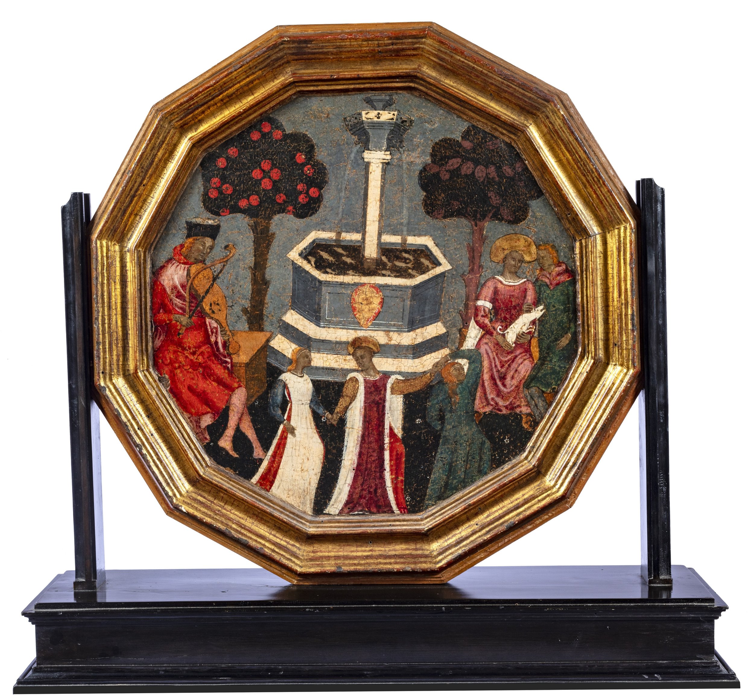 Octagonal golden tray showing a garden fountain with trees surrounded by musician and elegantly dressed female figures