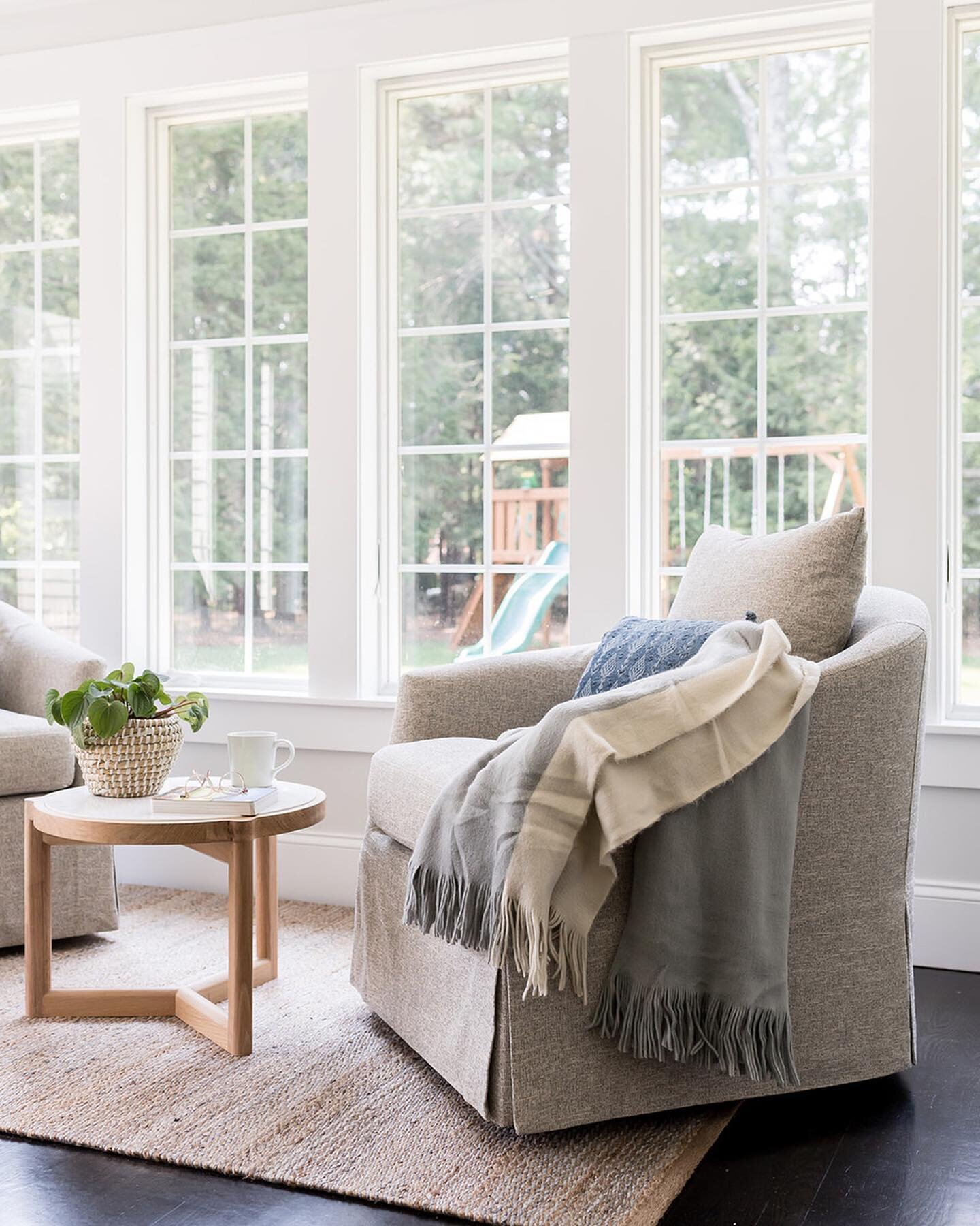 It's a swivel scene. Two chairs and a small coffee table anchored by a rug. What is your drink of choice for a spot like this? I recently found a recipe for a Strawberry Lemonade Aperol Margarita from @halfbakedharvest and it's officially on my summe