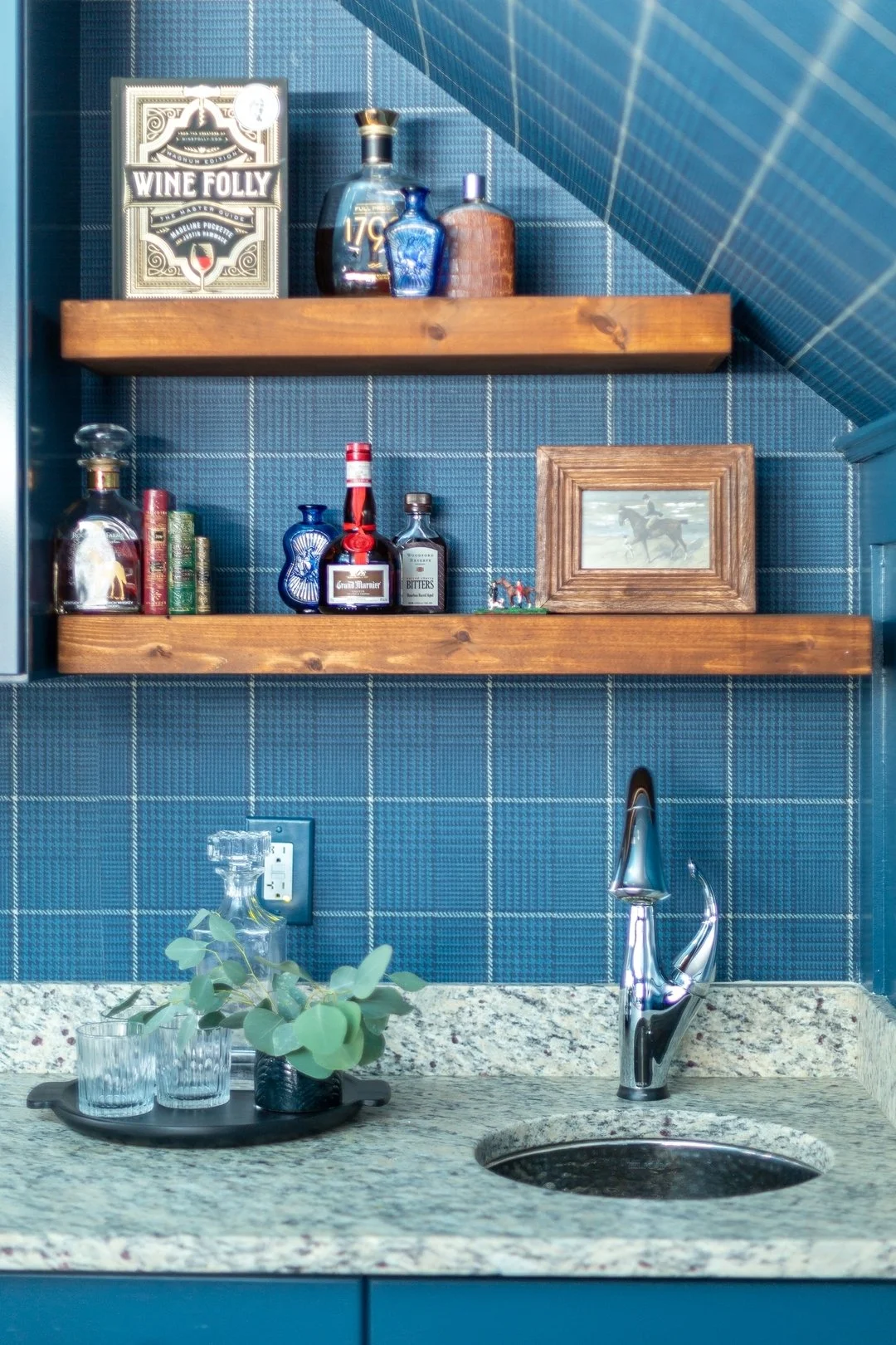 Wet bars and beverage centers don&rsquo;t have to be huge and custom to be wow. This mini bar area is made mighty with bold wallpaper, floating shelves and thoughtful decor (we left the cabinets, counter and faucet as is).

#designingfavoriteplaces

