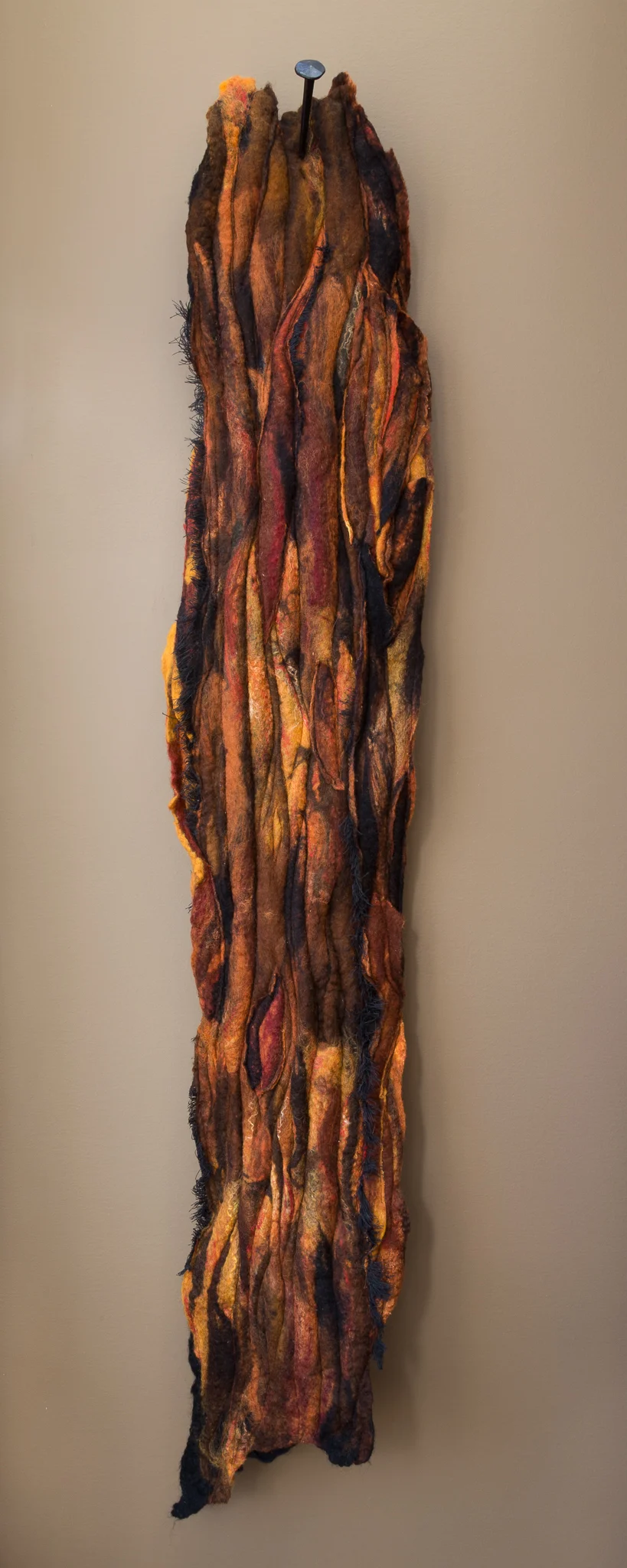 burnt handmade felt, mixed media 52 x 10 x 5