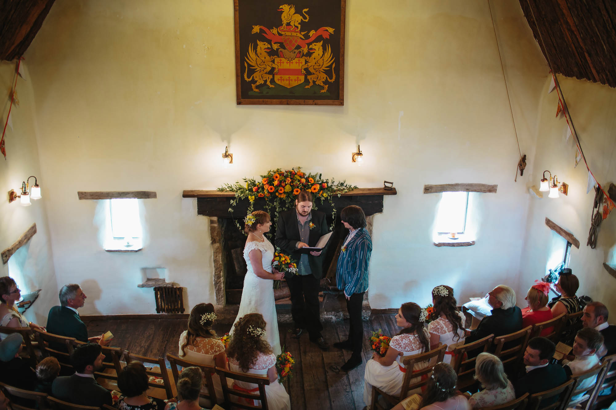 Wedding ceremony with bride and groom at the Craven Cruck Barn Yorkshire