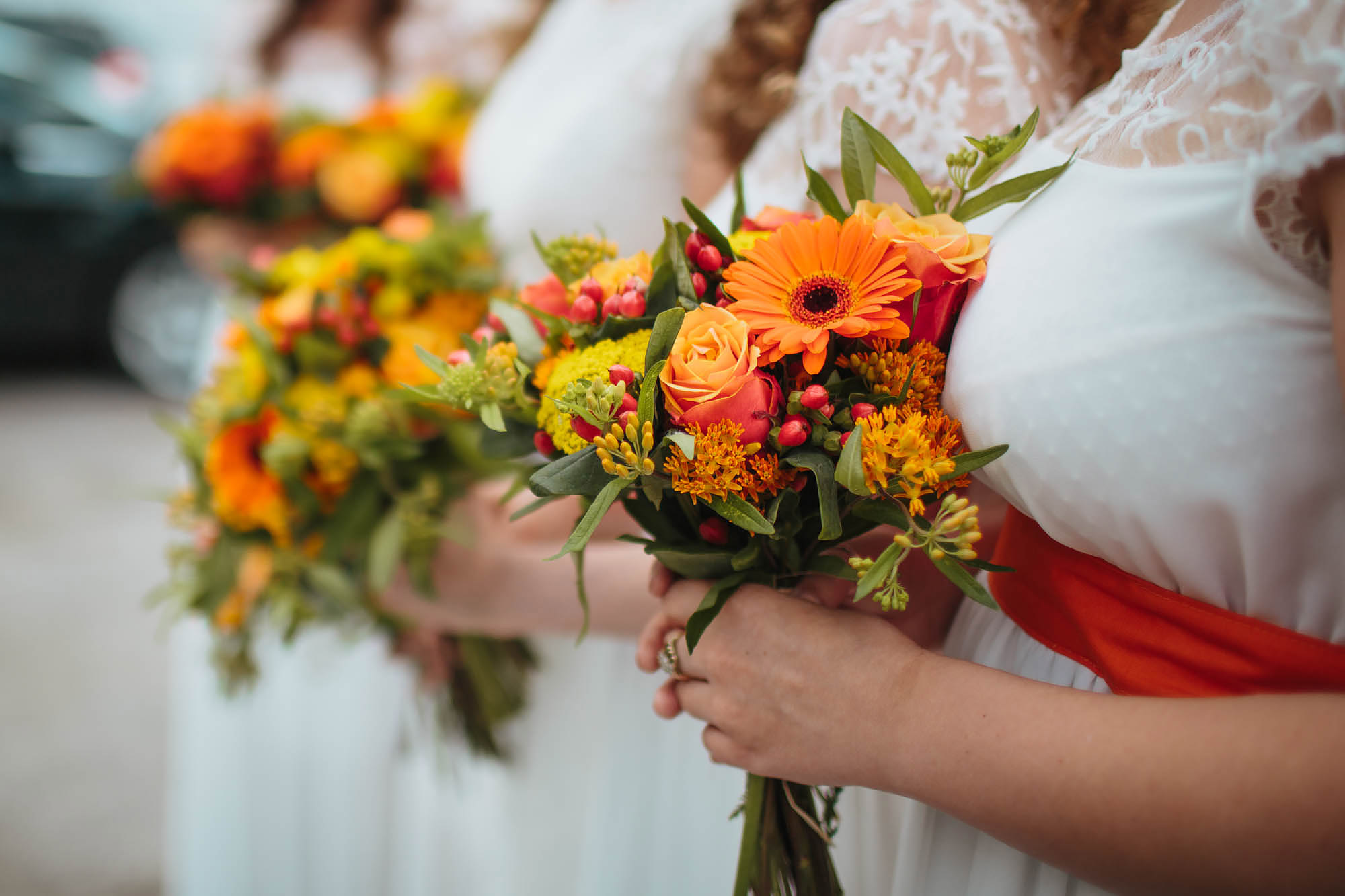 Bridesmaids hold their bouquets at a wedding in Yorkshire