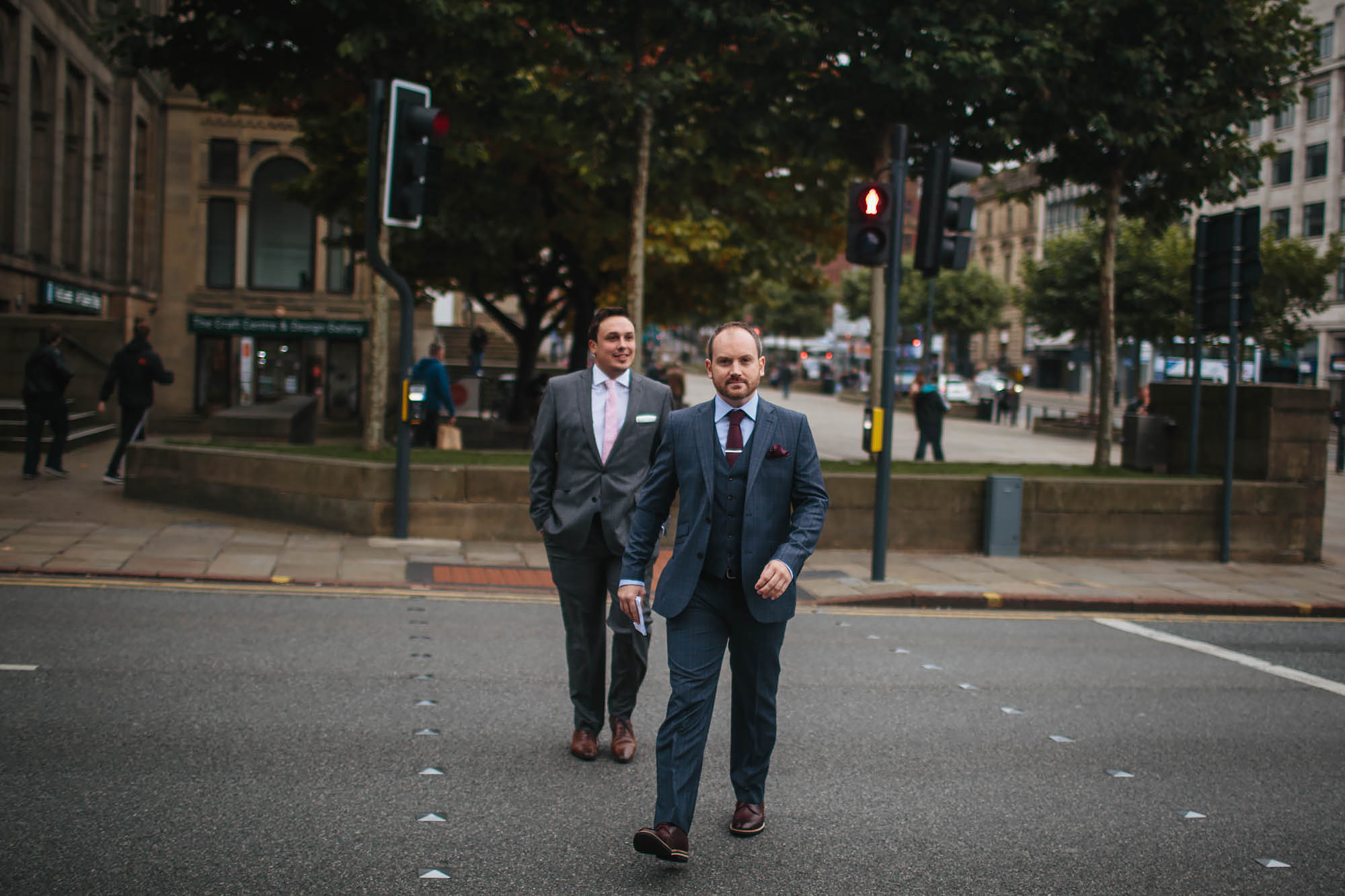 Groom walks to his wedding at Leeds Town Hall