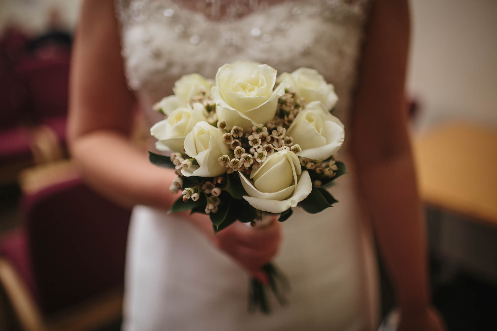 Bride holding her bouquet at Leeds Town Hall