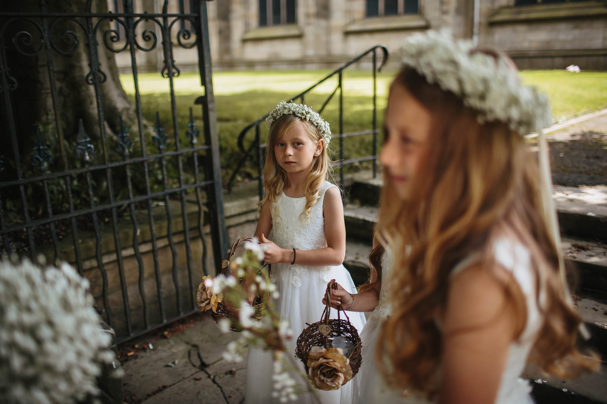 Flower girl looks nervous at the church in Manchester