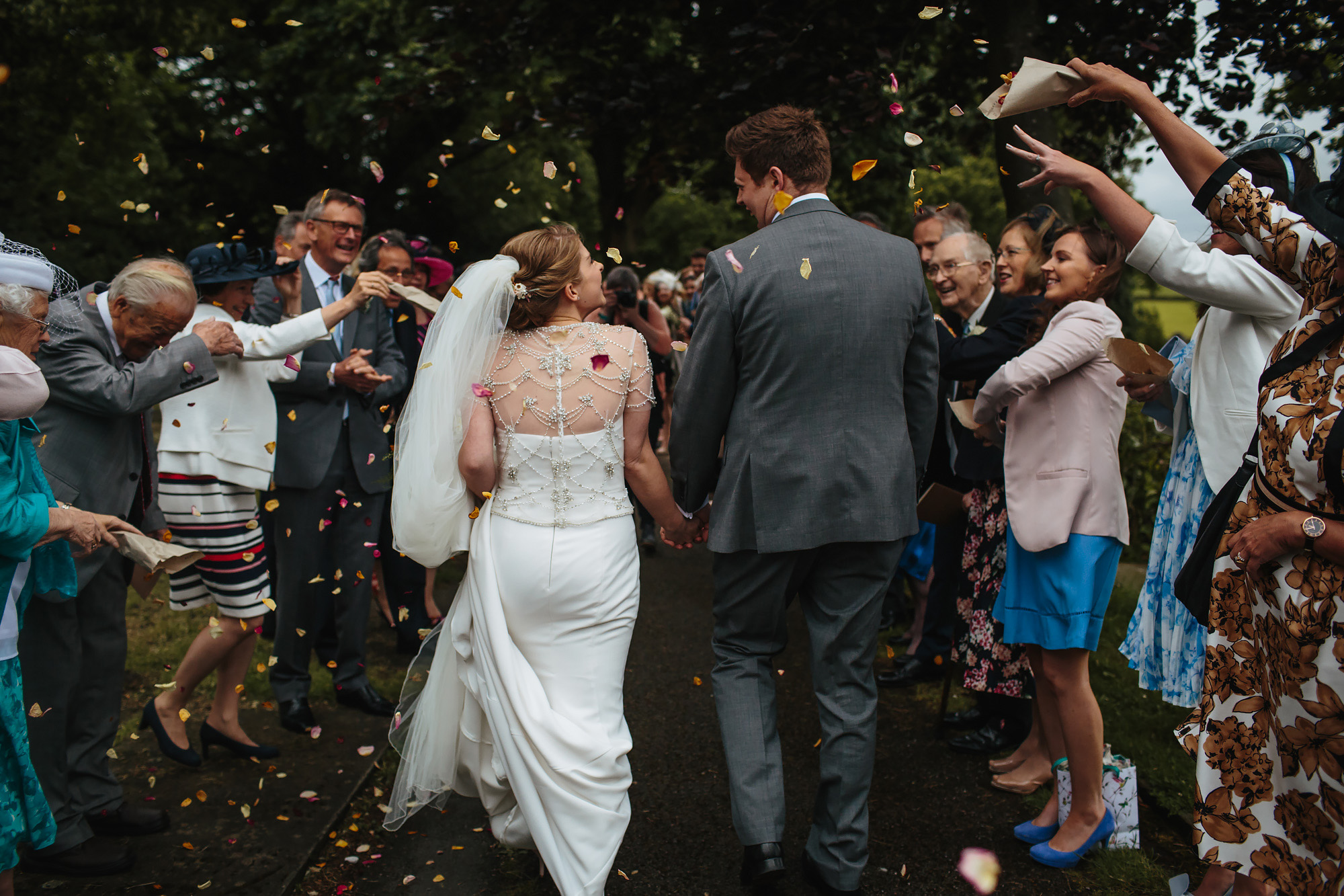 Throwing confetti on the Bride and Groom at a wedding