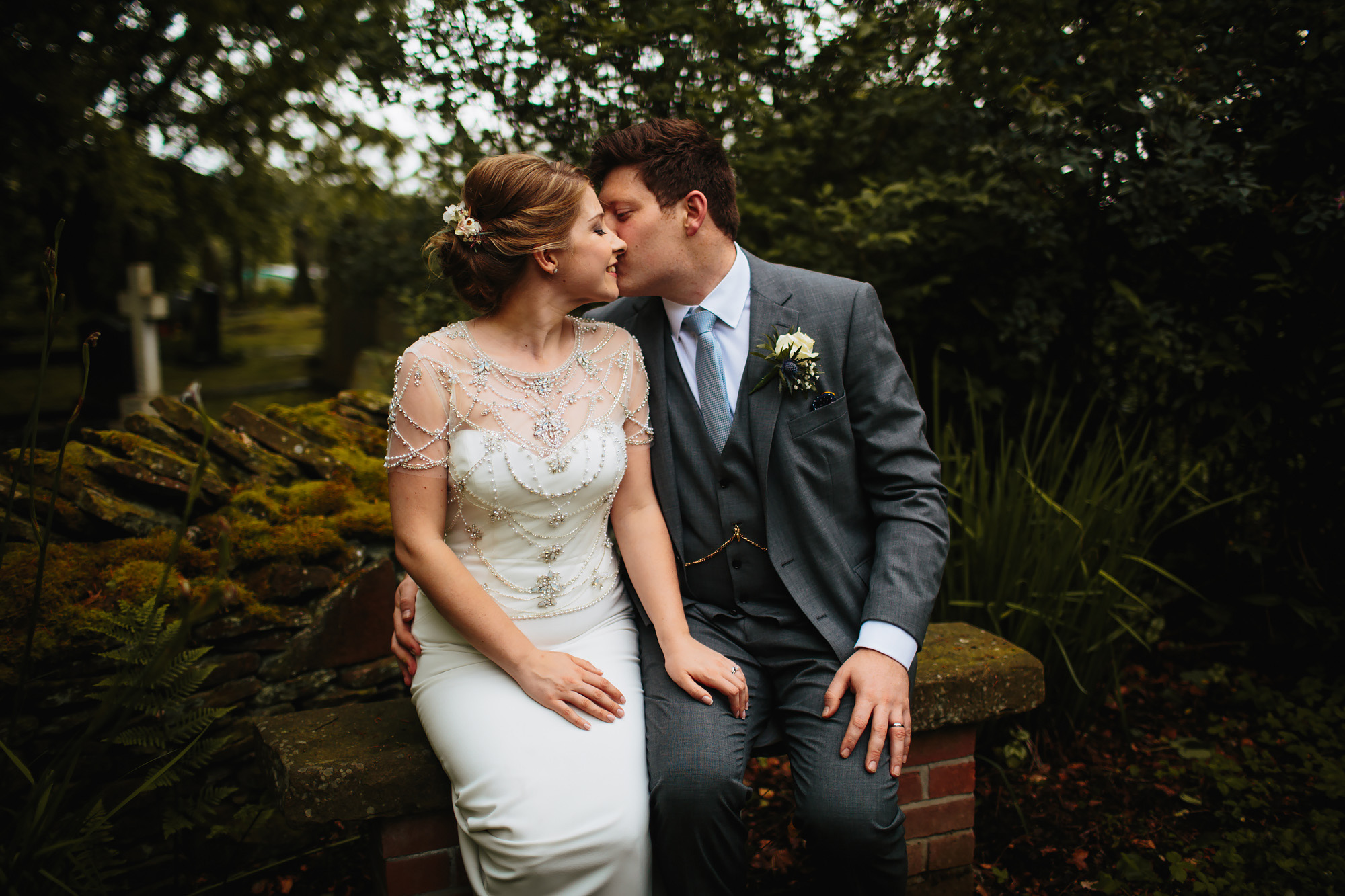 Bride and groom kissing for their portrait on a Lancashire wedding