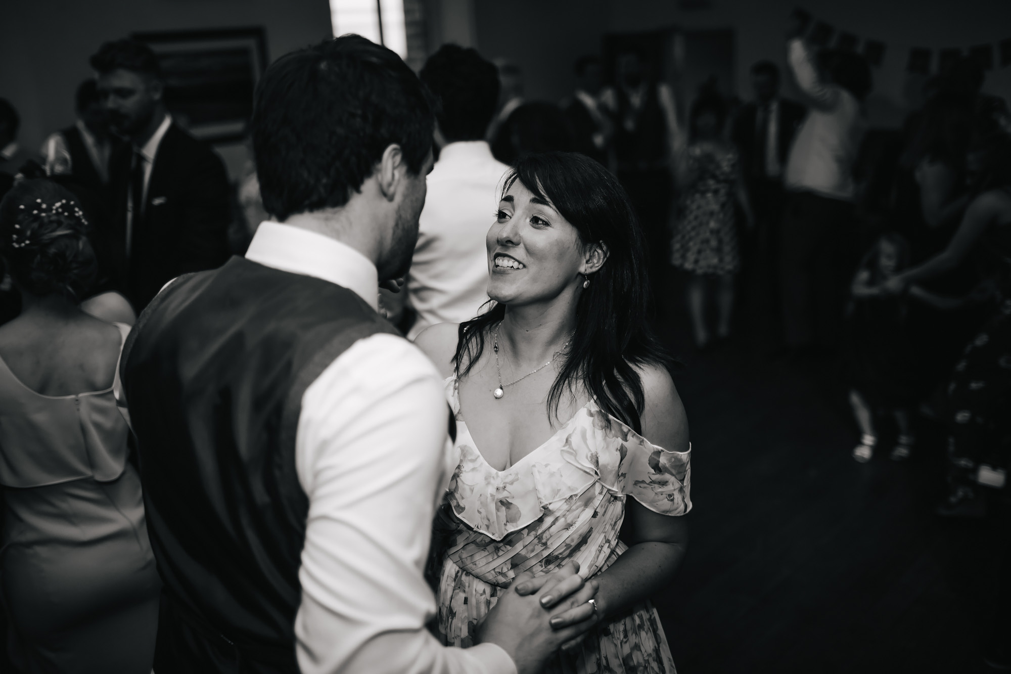 Wedding guests dancing at a village hall in Lancashire
