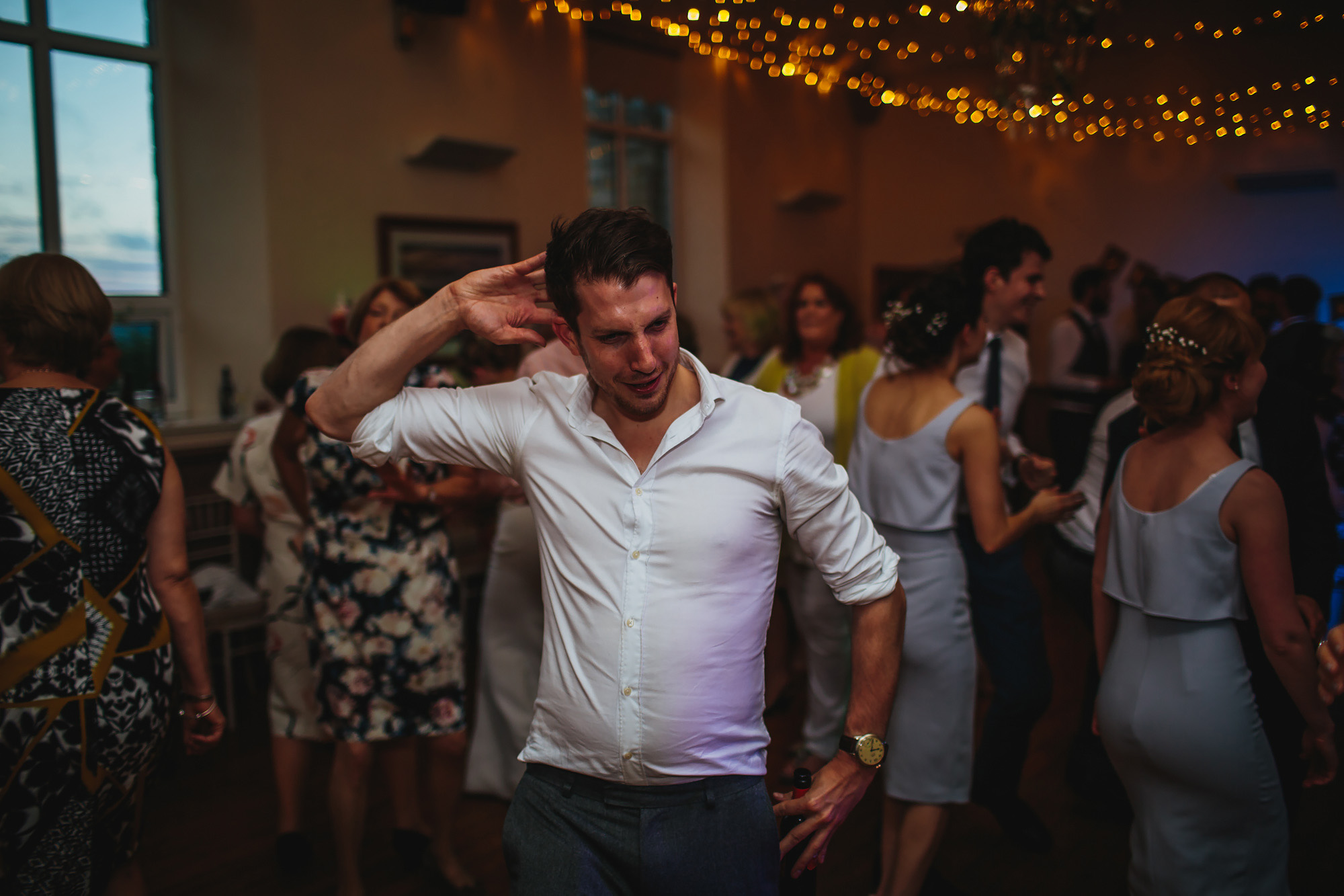 Sweaty man dances at a wedding and its funny