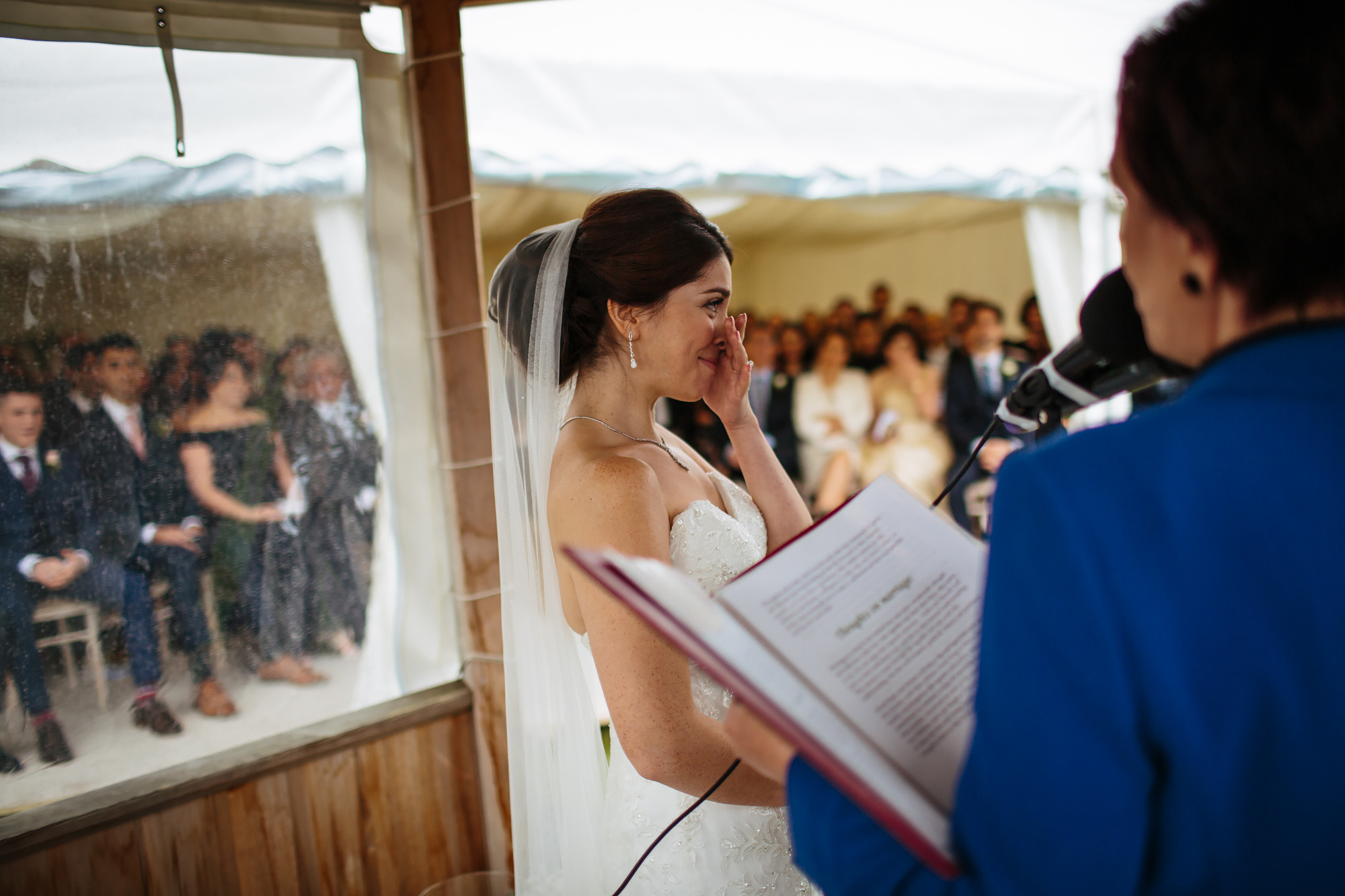 Bride laughs during the wedding ceremony