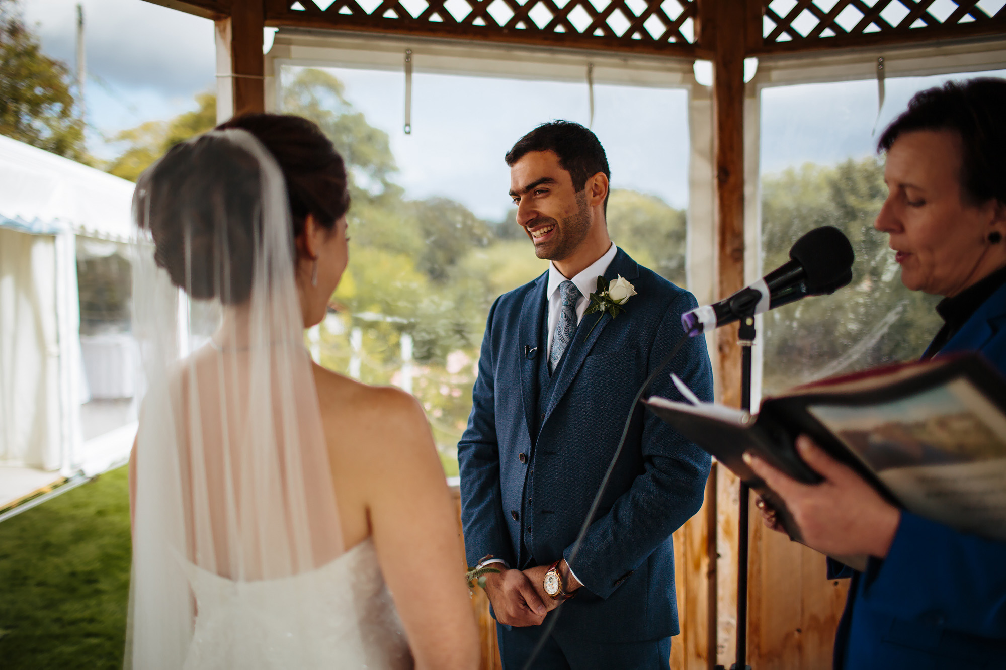 Groom laughing during the wedding ceremony