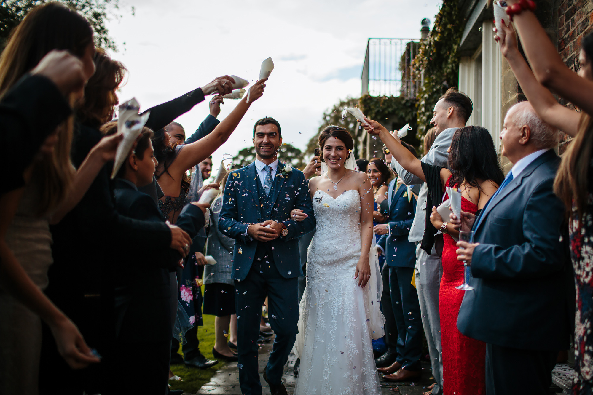 Throwing confetti at a wedding in Yorkshire