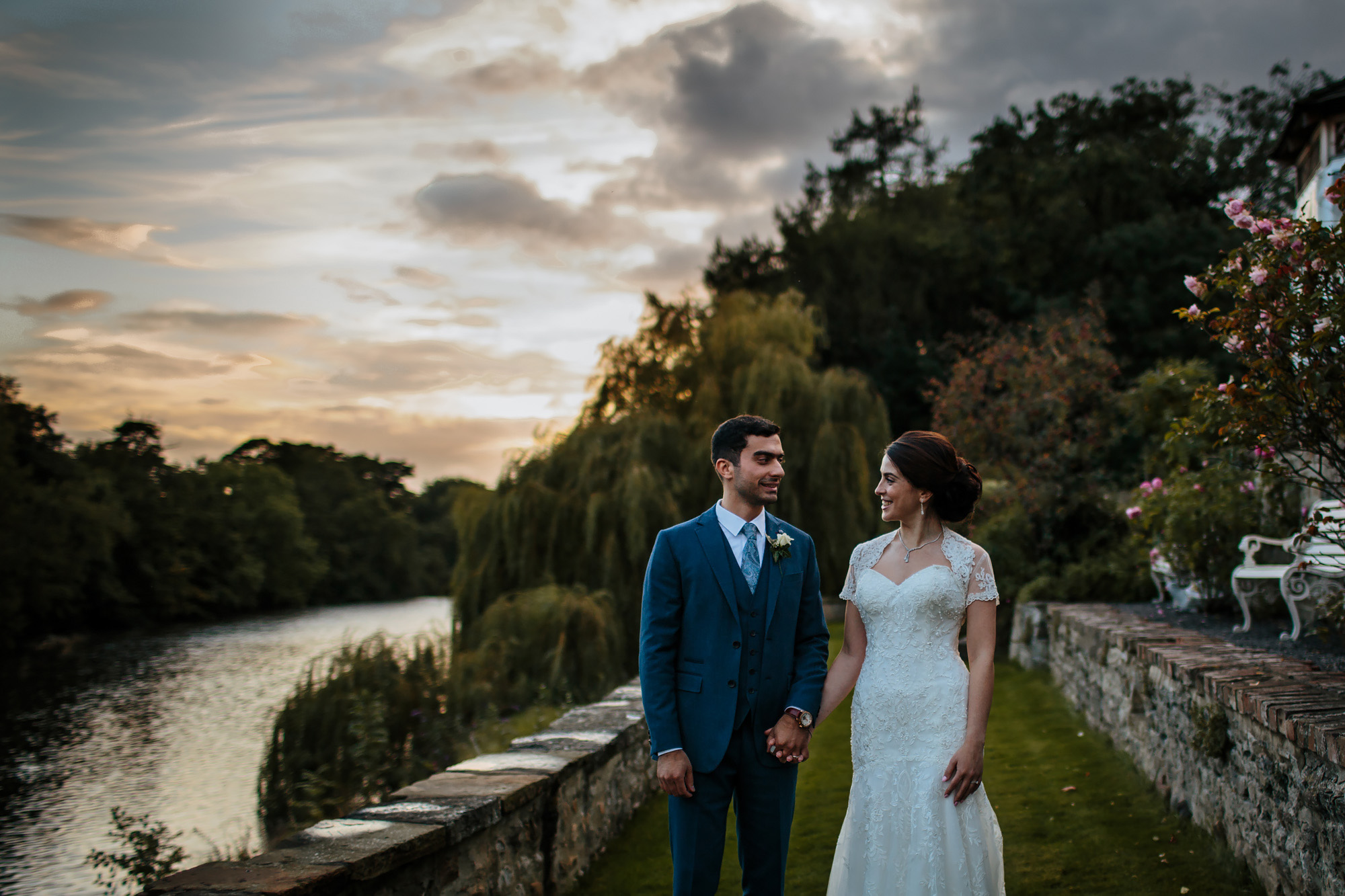 Portrait of the bride and groom at sunset by a river in Yorkshire