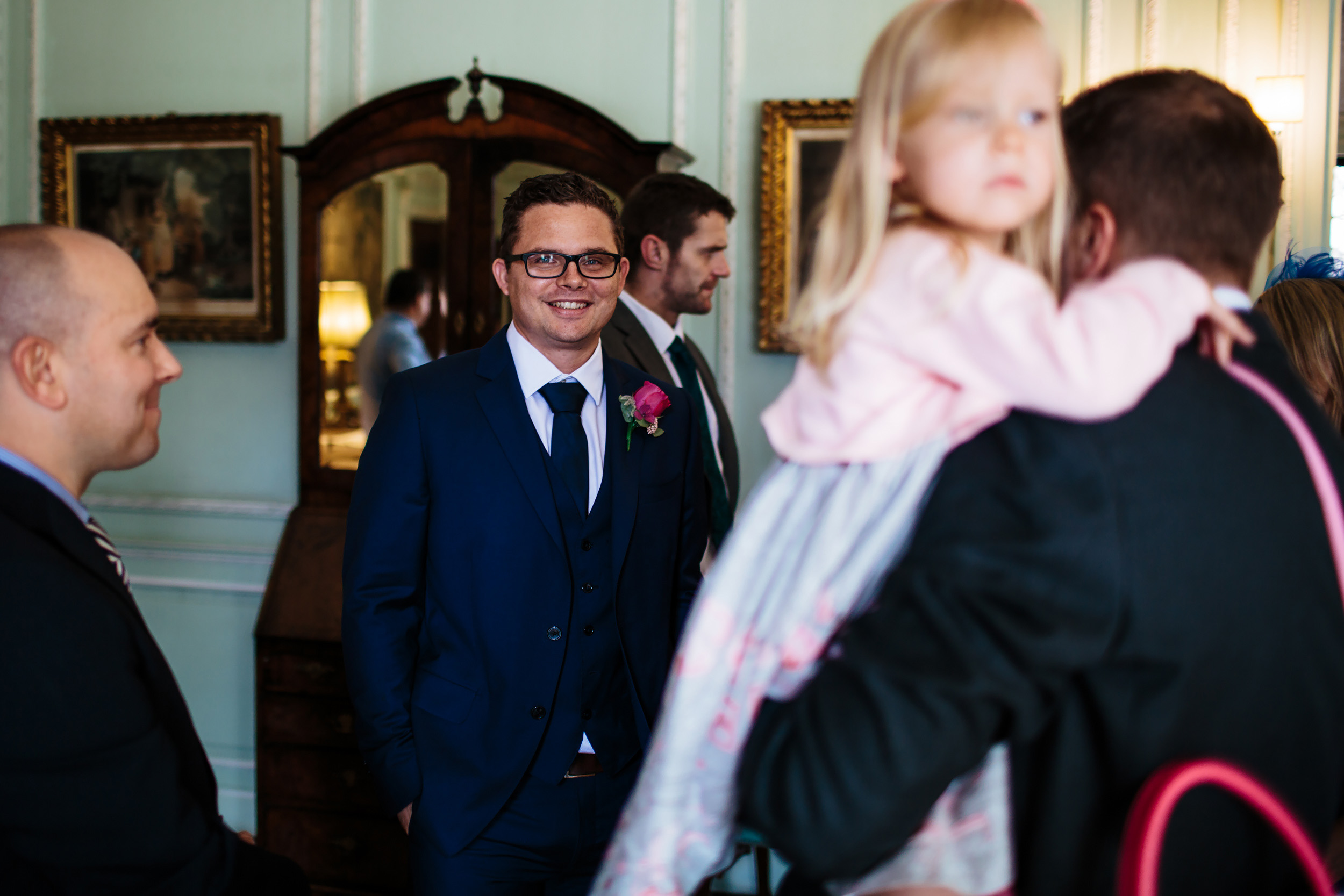 Groom smiling at Thornton Manor in Cheshire at a wedding