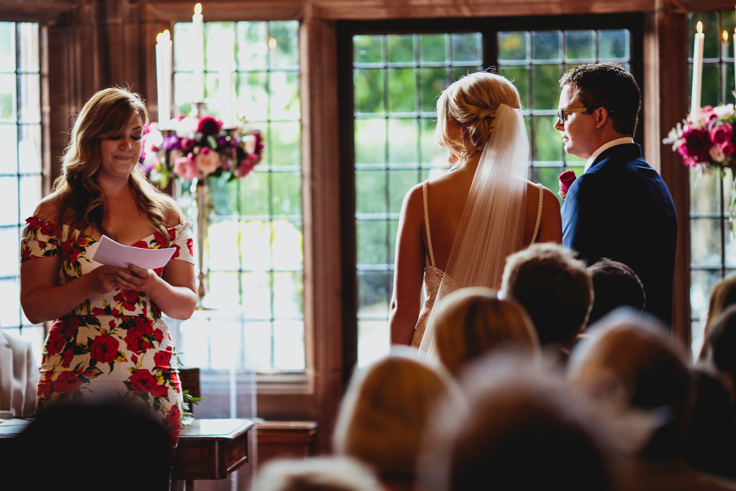 Guest reading during a wedding ceremony at Thornton Manor Cheshire