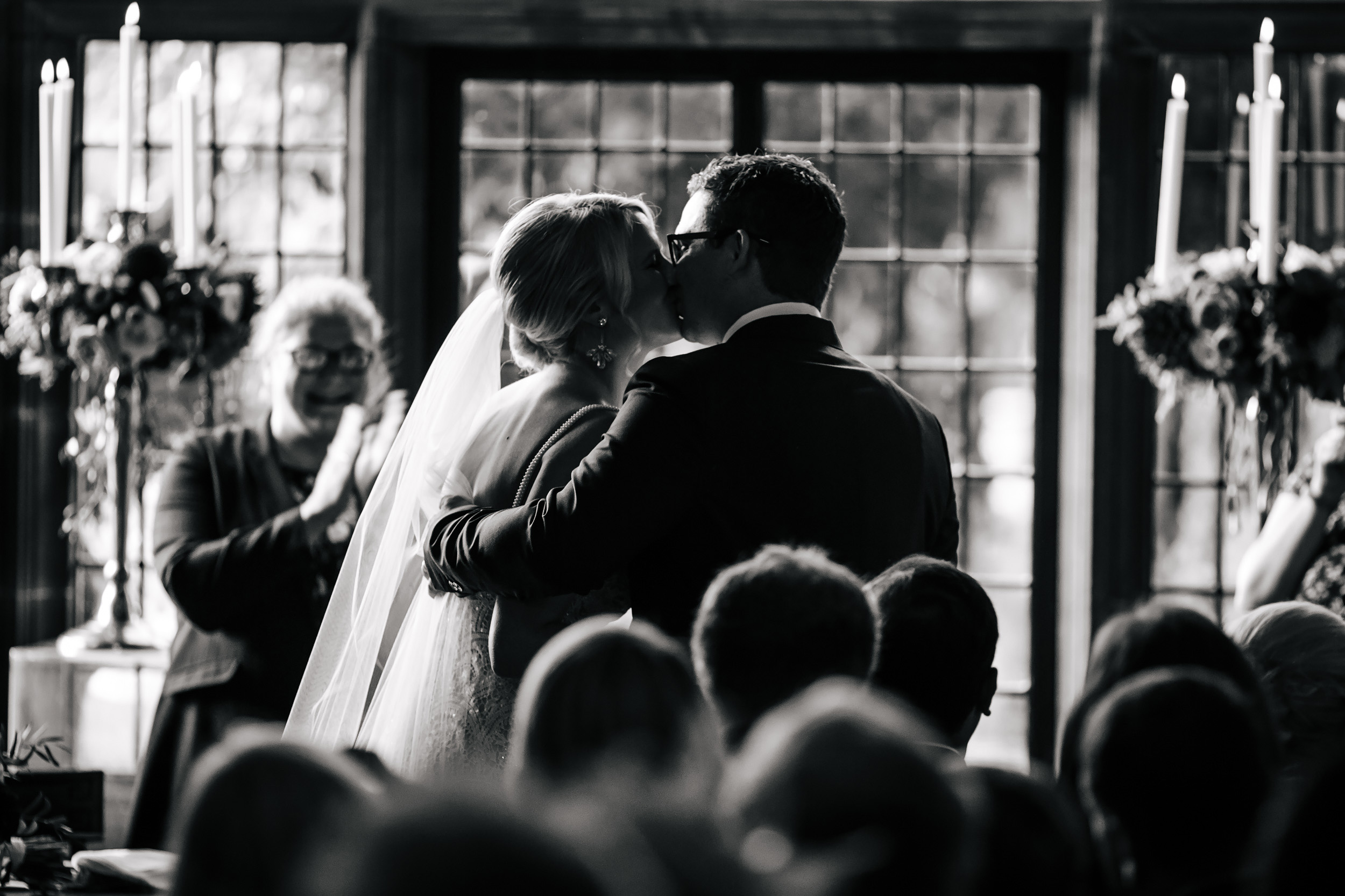 Bride and groom kiss at their wedding ceremony