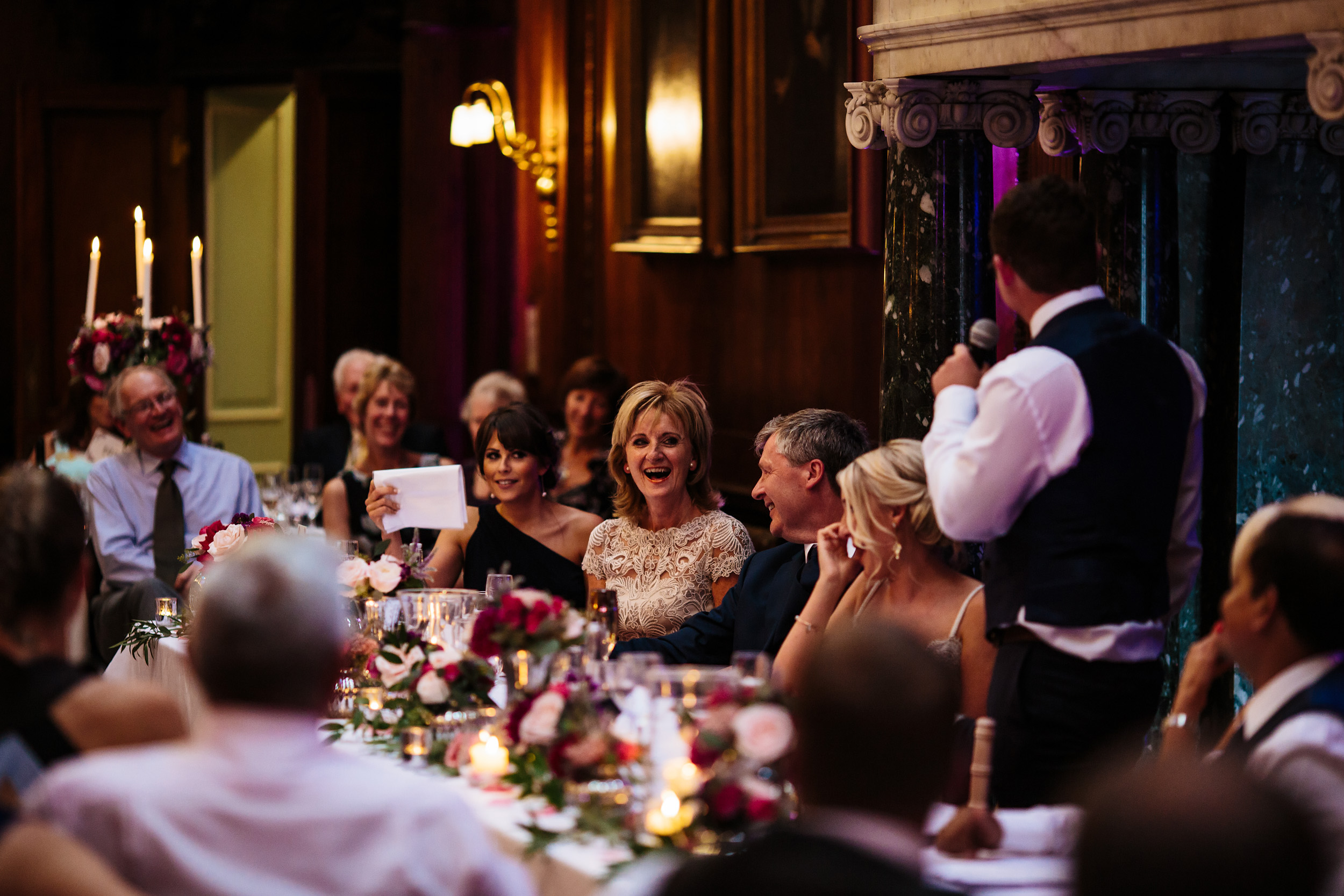 Brides mother laughing during the grooms speech at a wedding