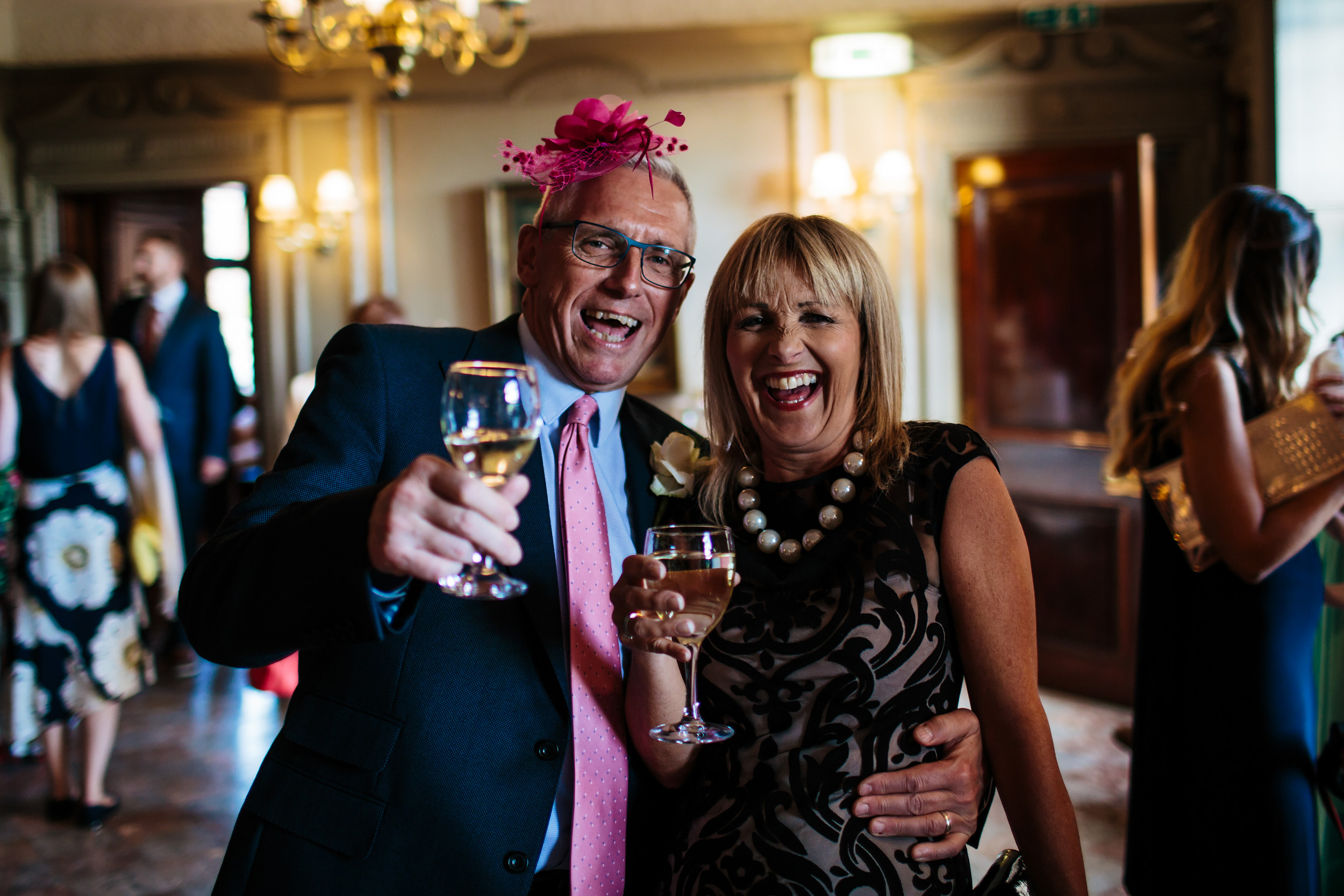 Guests laughing at a wedding in Cheshire