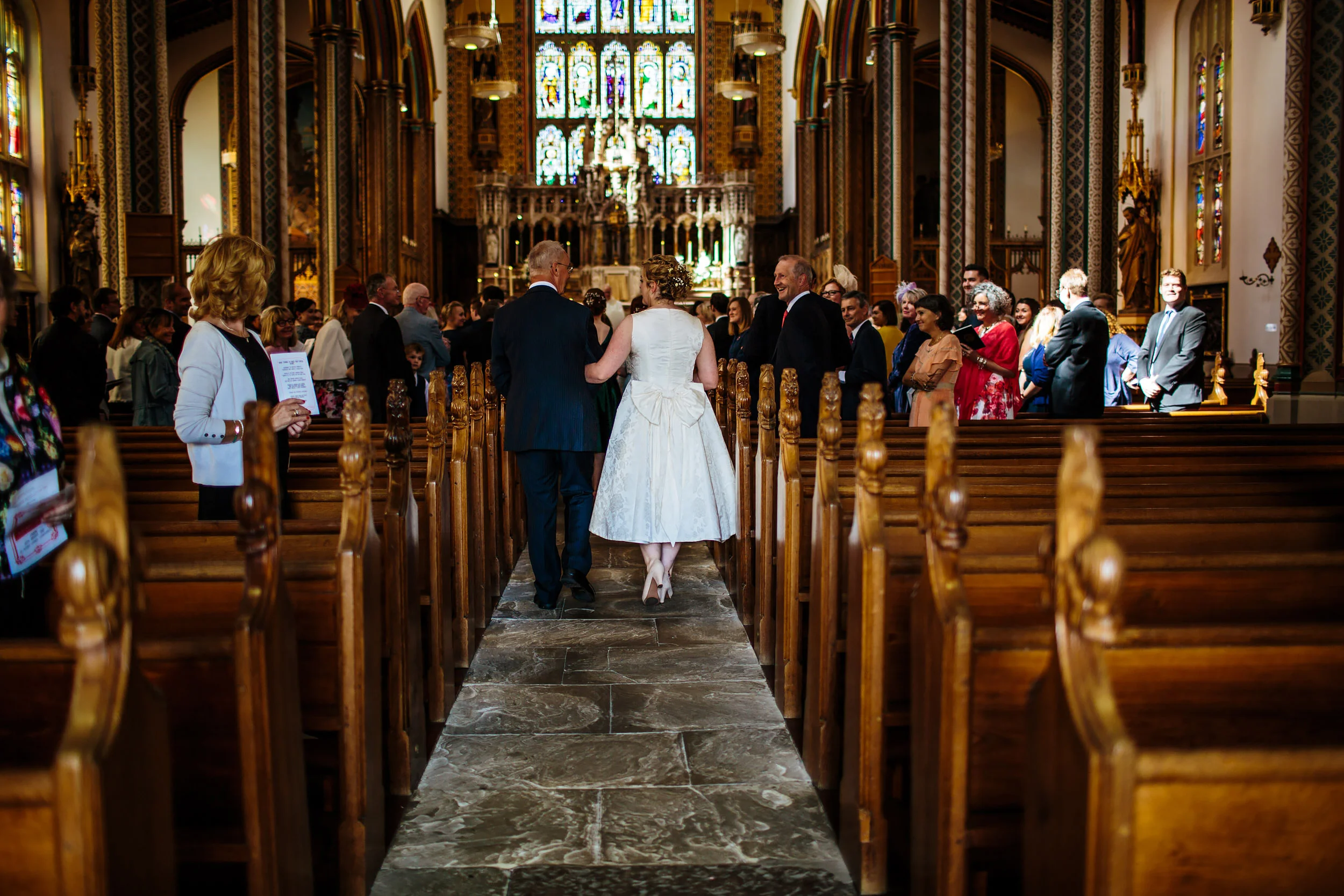 Bride and her father walk down the aisle at a Lancashire wedding