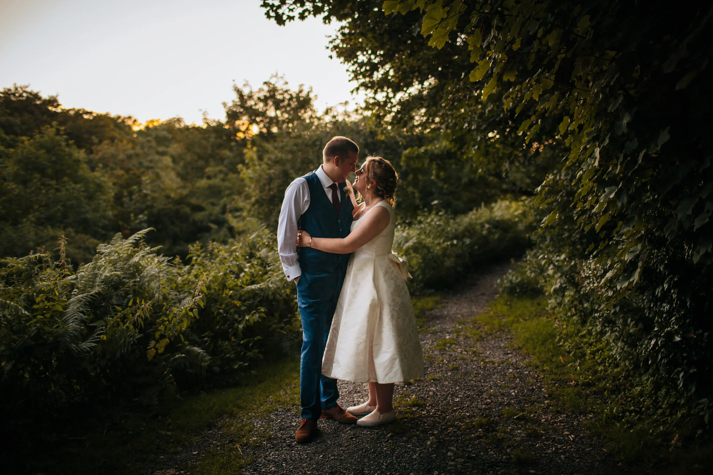 Bride and groom pose for a photograph in Lancashire