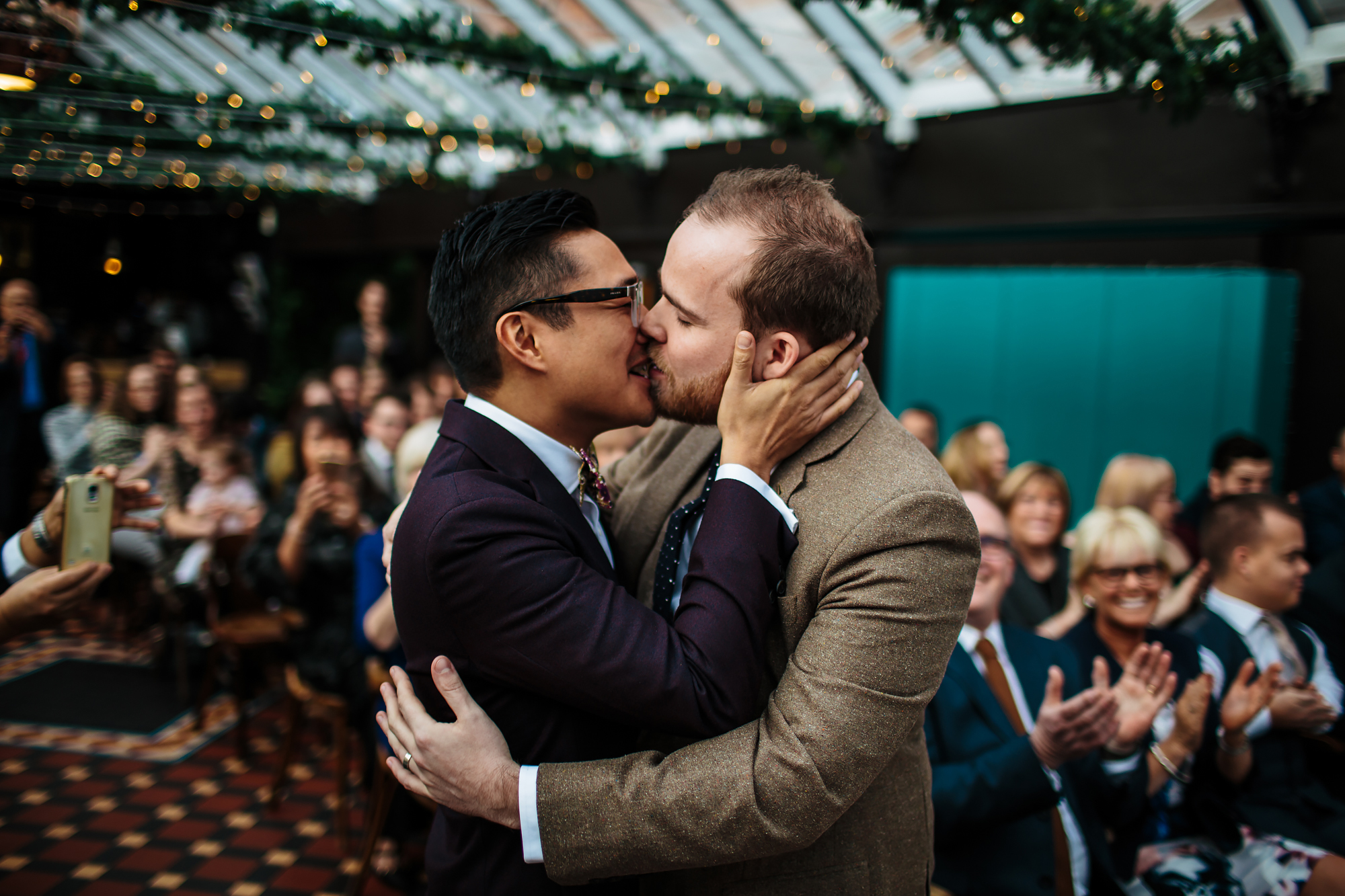 Grooms kissing at a gay wedding in Yorkshire