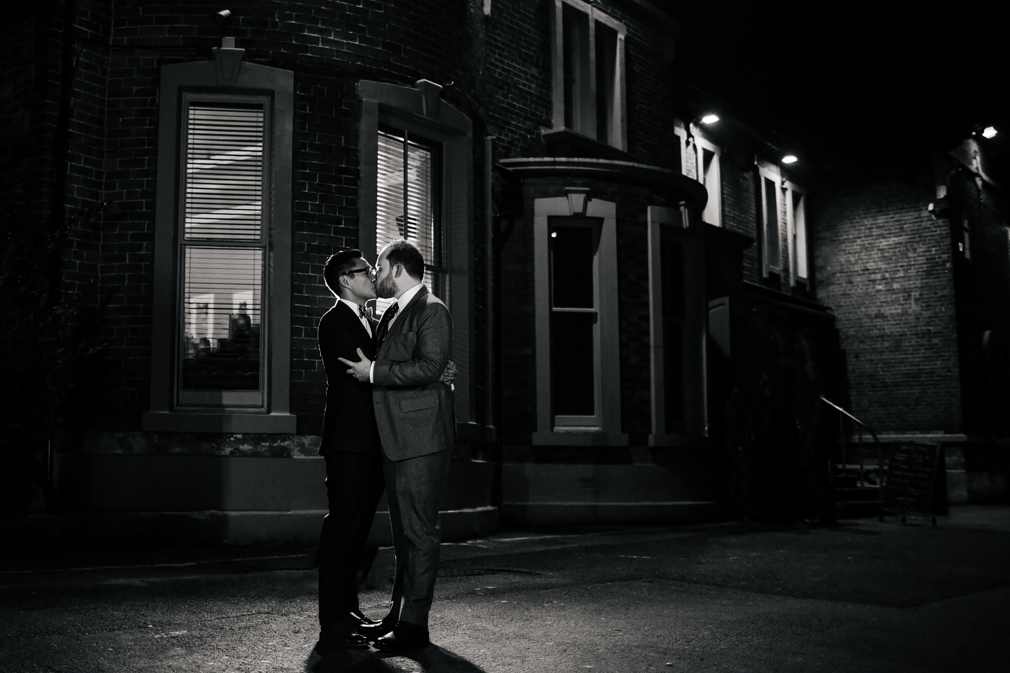 Grooms kissing at a gay wedding in Yorkshire