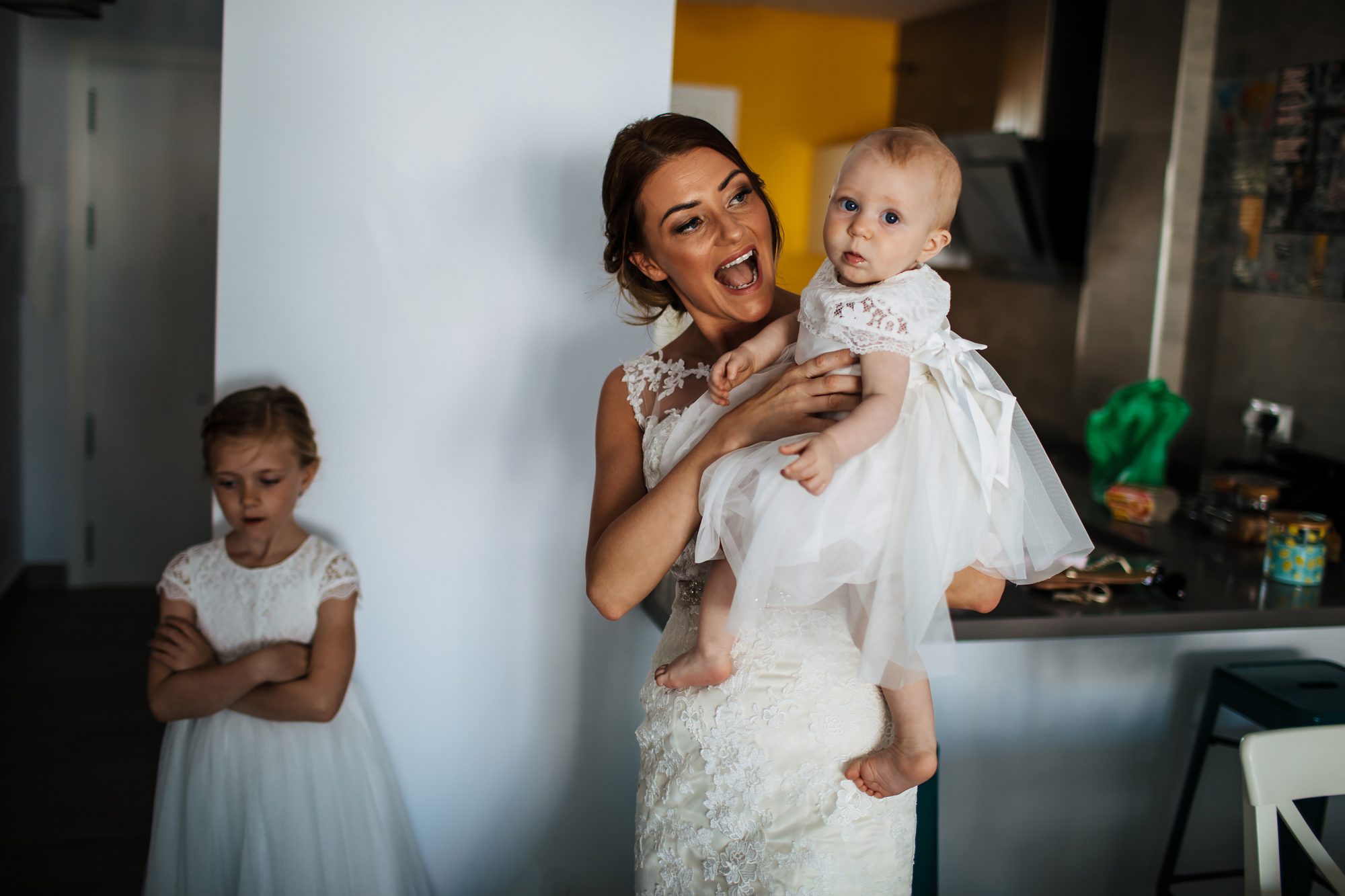 Bride holding daughter before her wedding in Nerja Spain