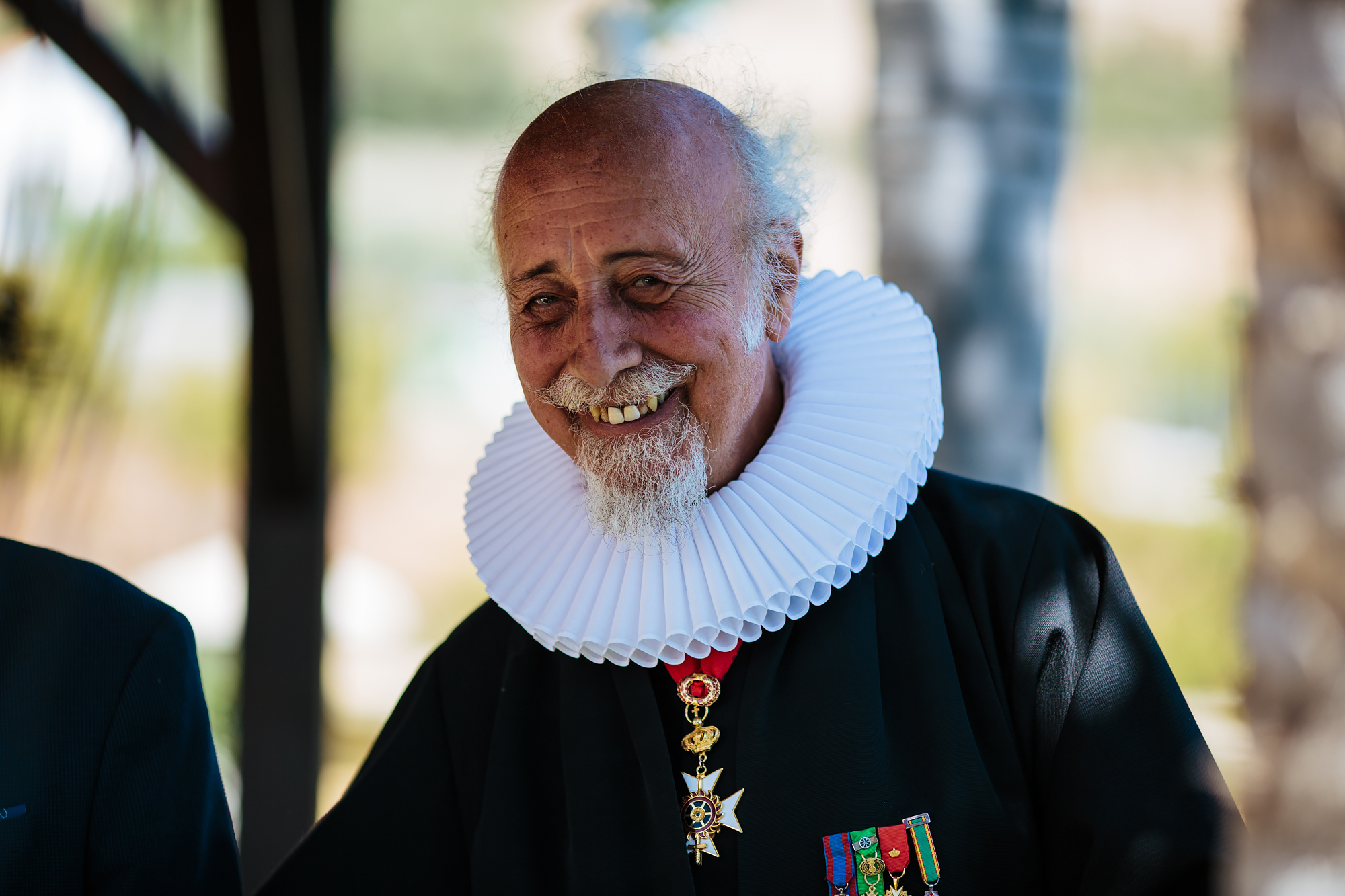 Portrait of the priest at a Spain destination wedding