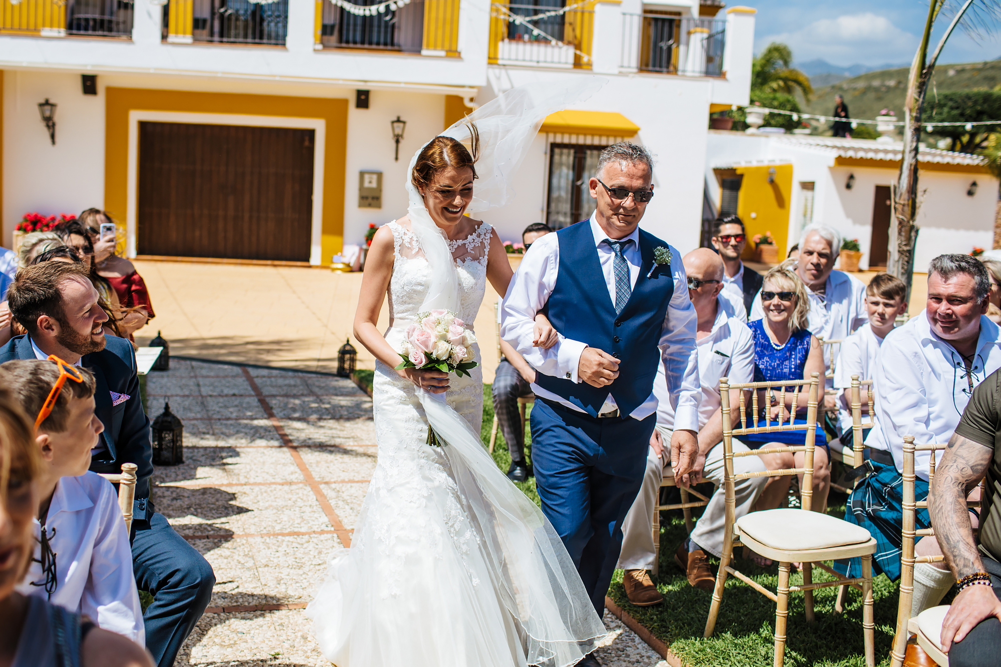 Bride and father walk down the aisle at Cortijo Maria Luisa Nerja Spain