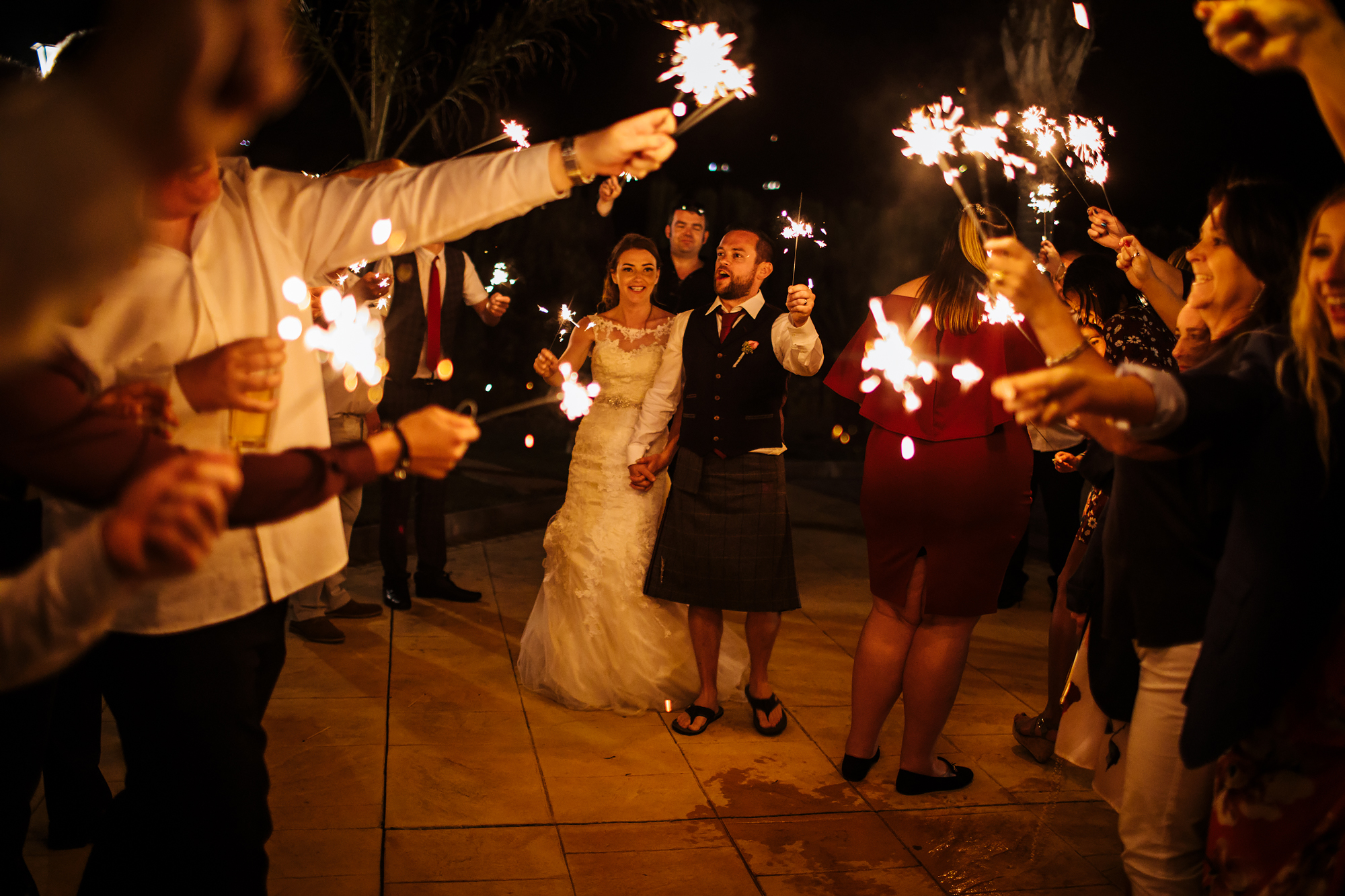 Bride and groom with sparklers at a wedding