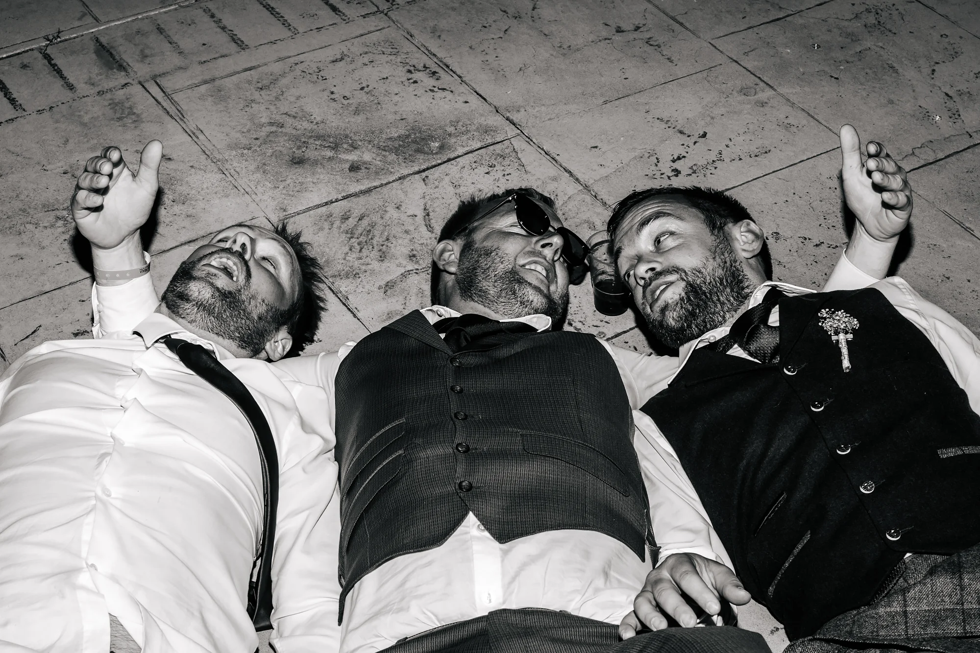 Groom and friends on the floor at a wedding