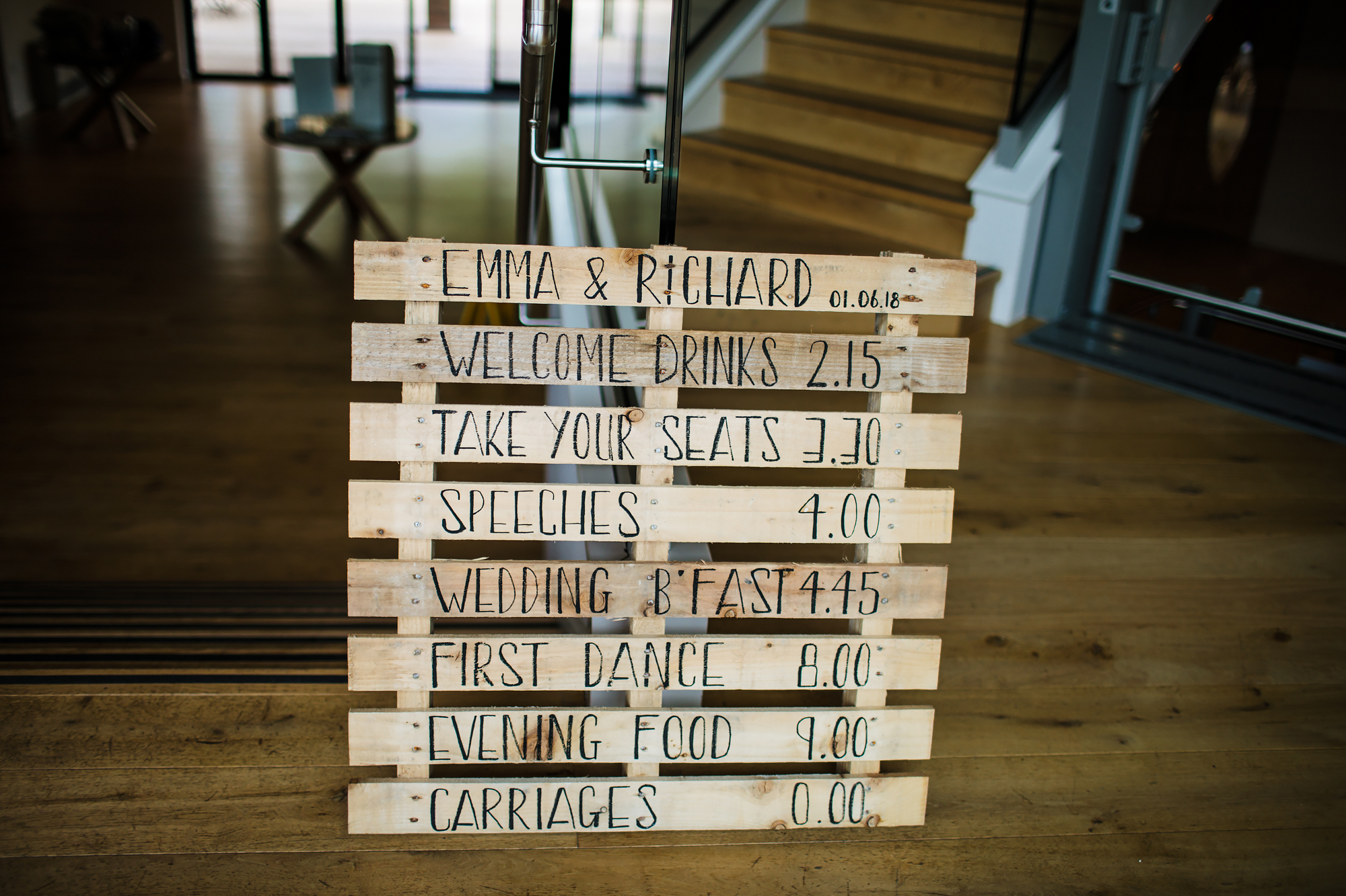 Wooden wedding itinerary sign 