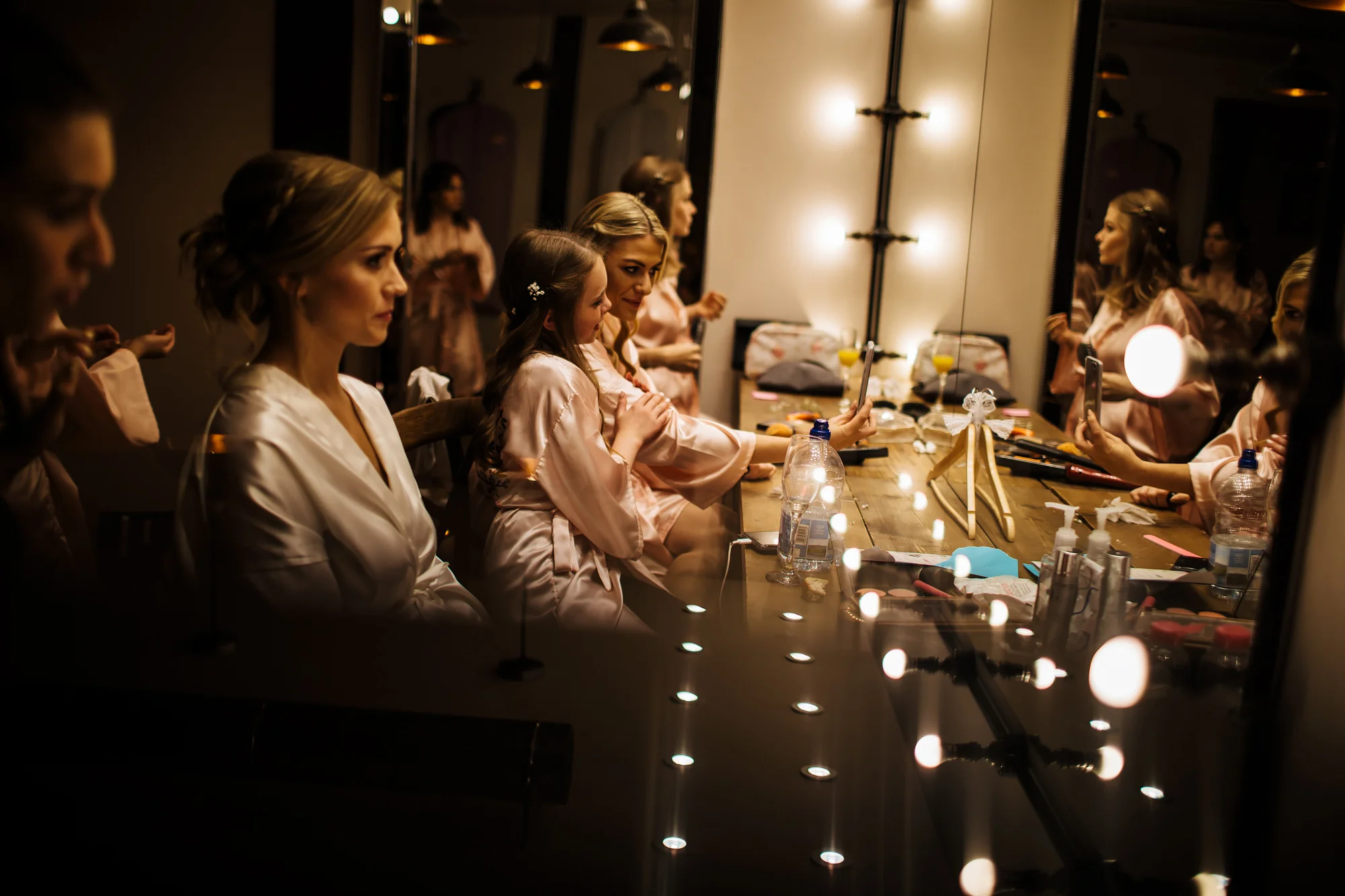 Bride and her bridesmaids getting ready