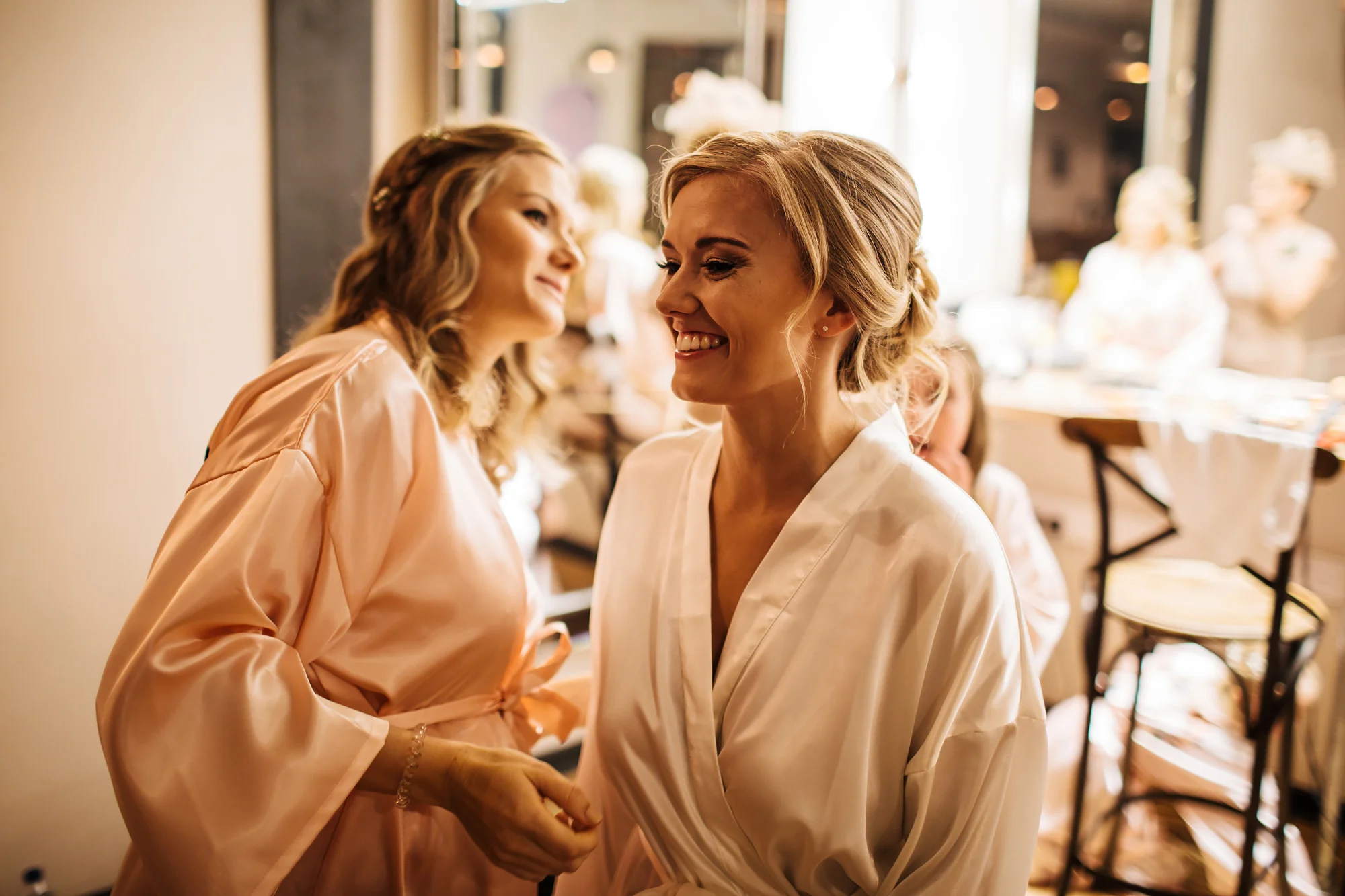Bride having her make up applied before her wedding