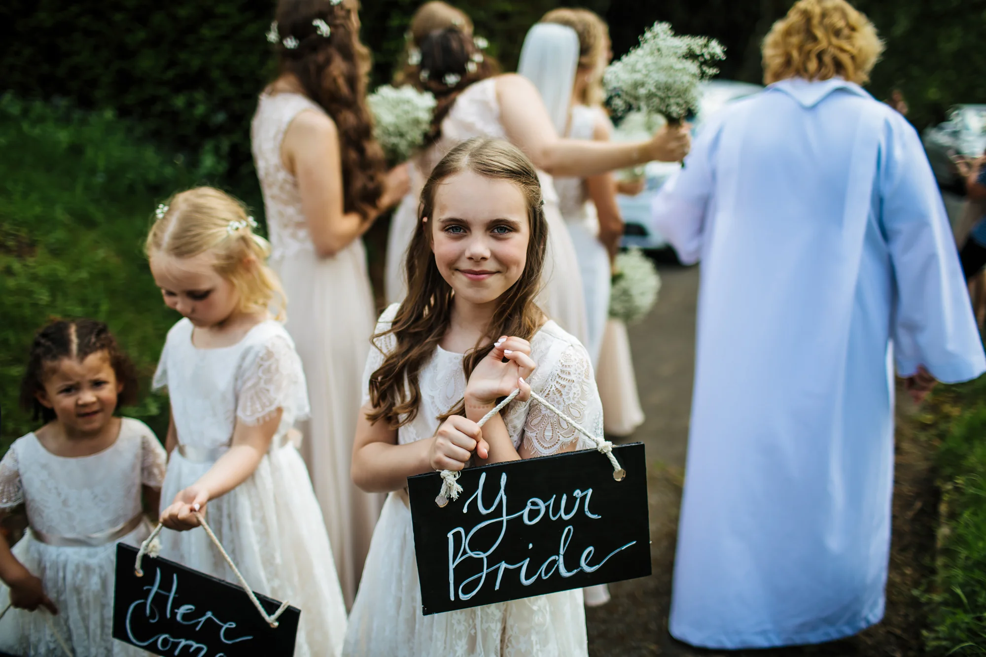 Young bridesmaid outside a church wedding
