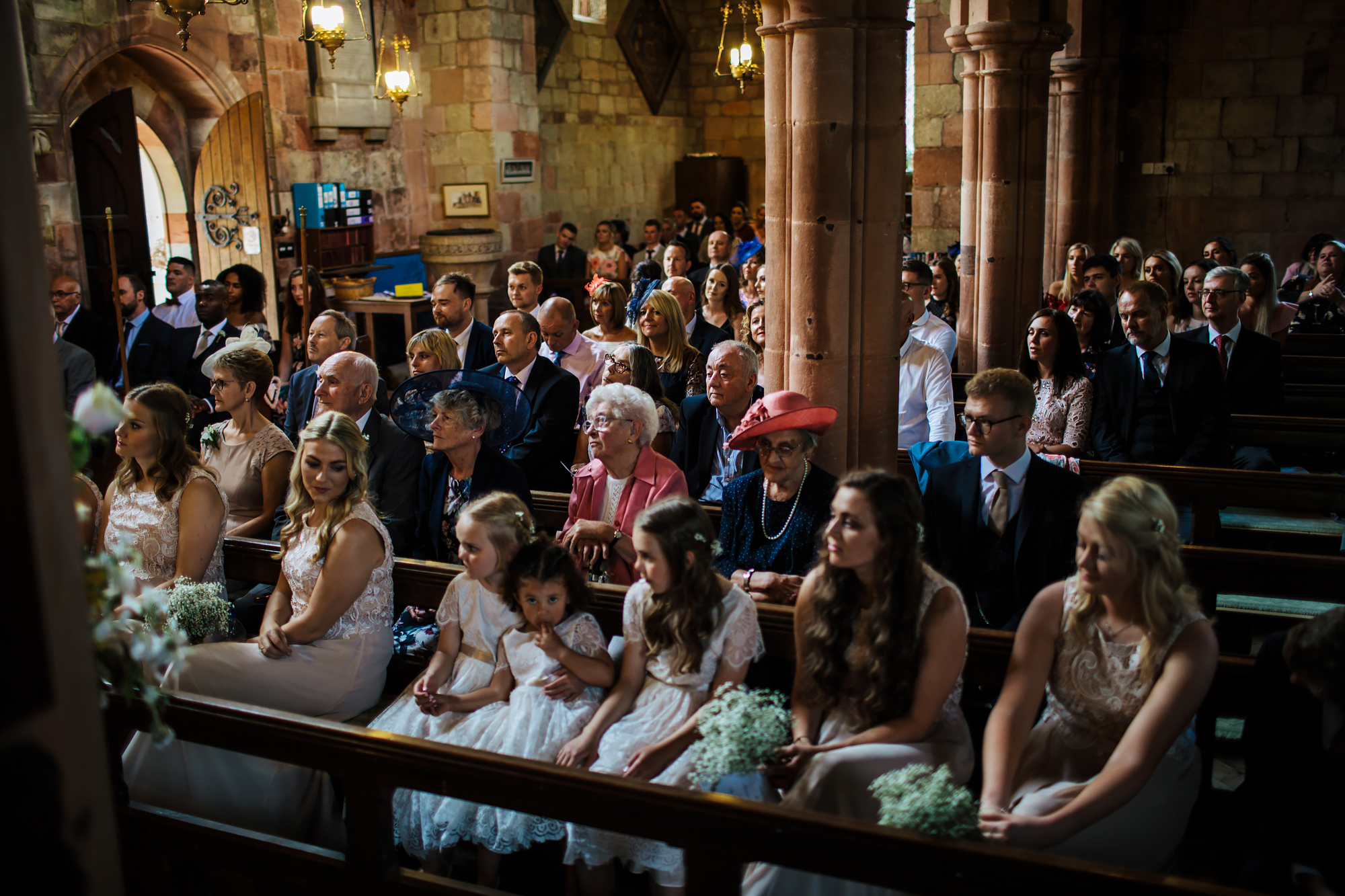 Wedding guests and bridesmaids in the church