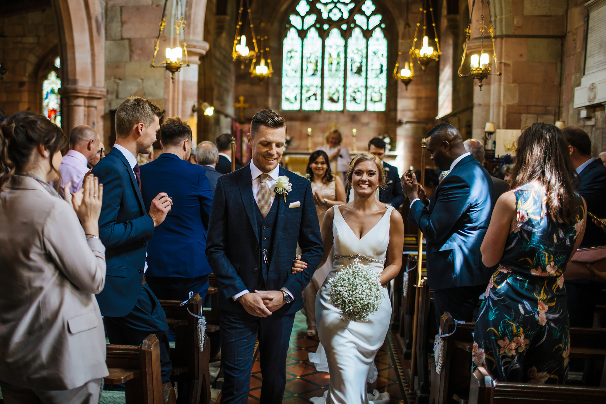 Bride and groom walk down the aisle at a Shropshire wedding
