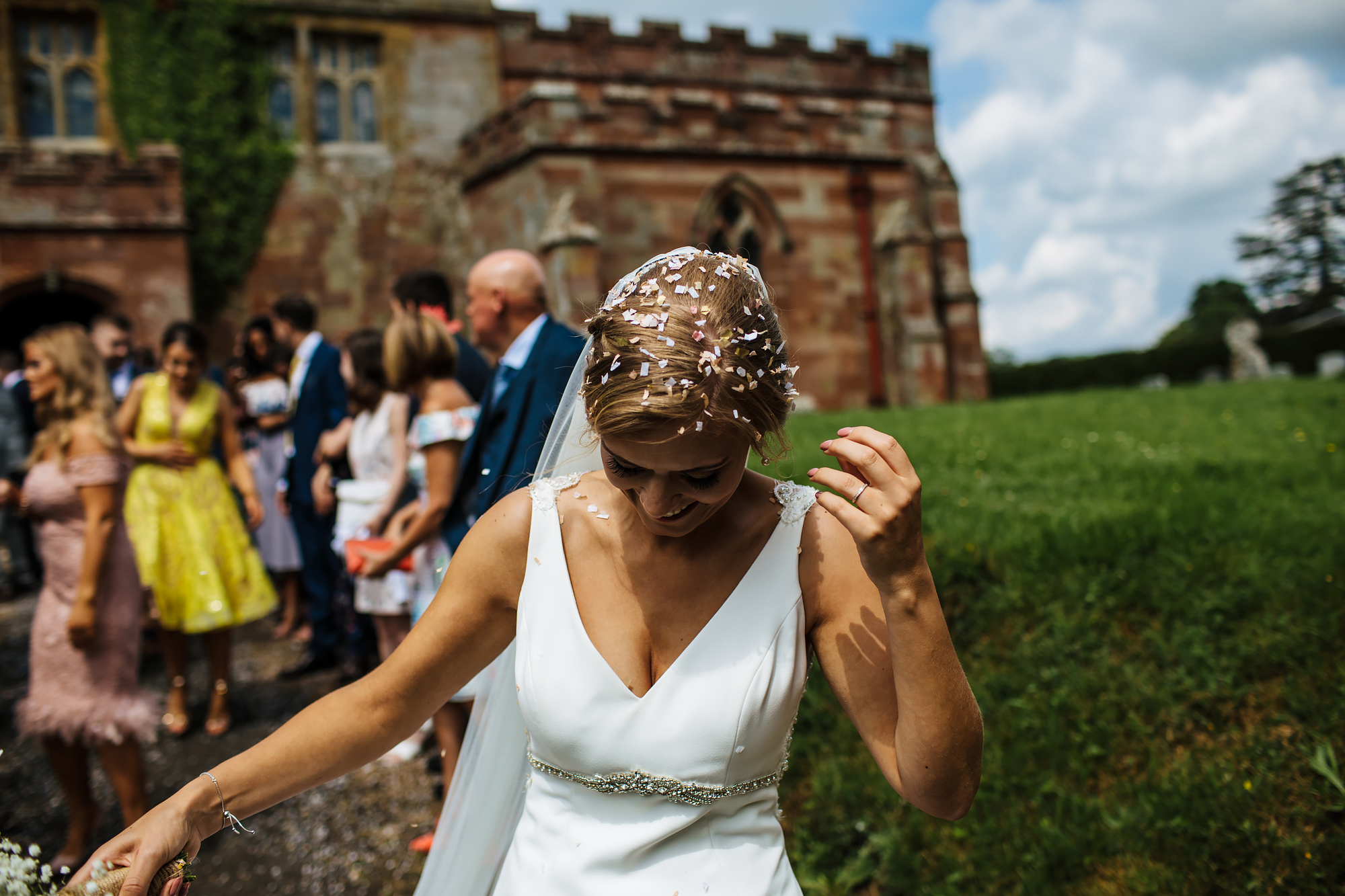 Bride with confetti in her hair at a wedding