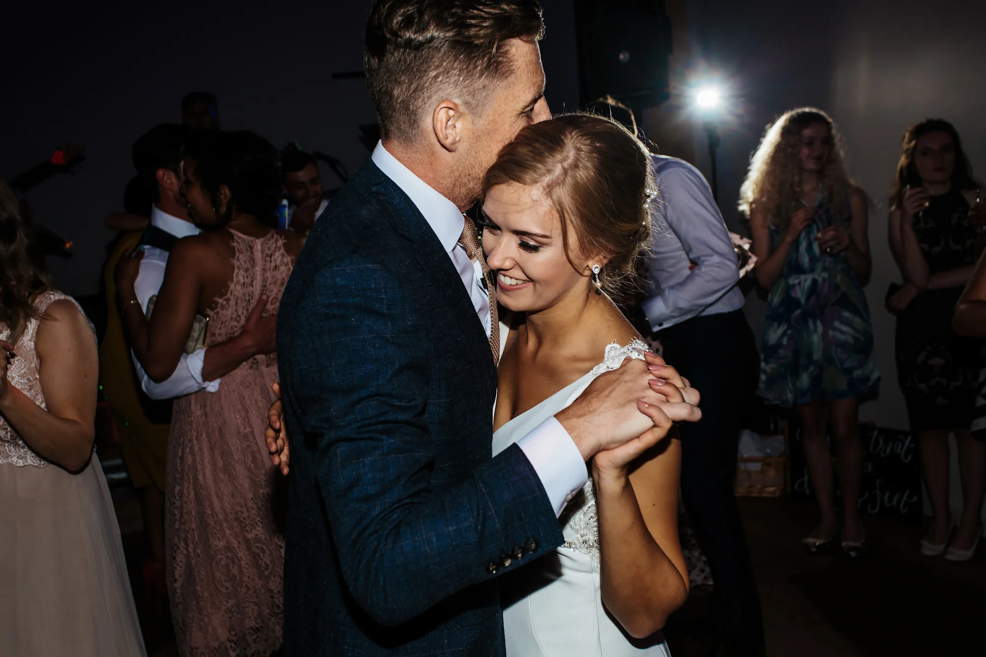 Bride and groom dance together at Mill Barns Wedding Venue Shropshire