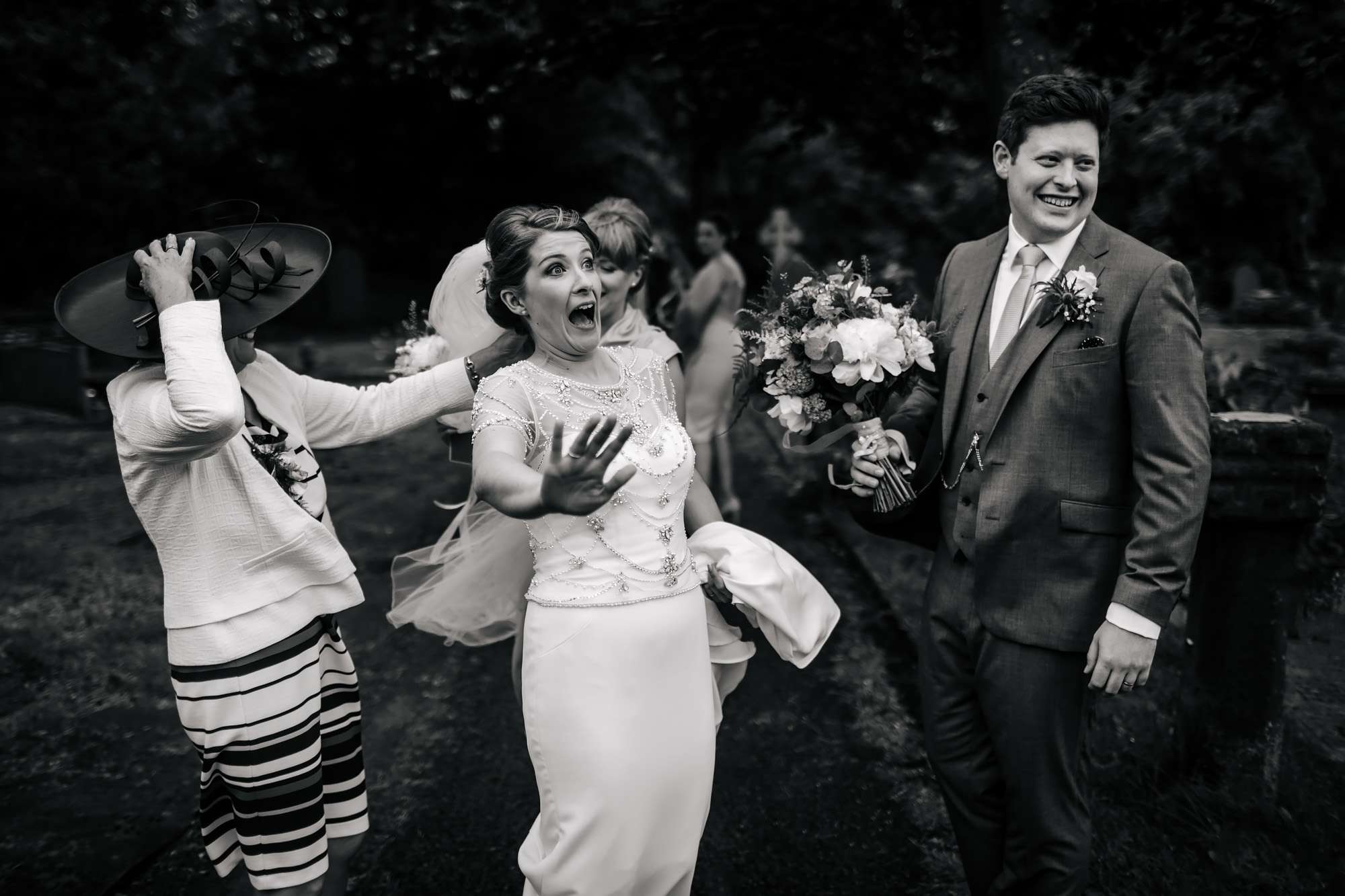 Bride Laughing as her veil blows away