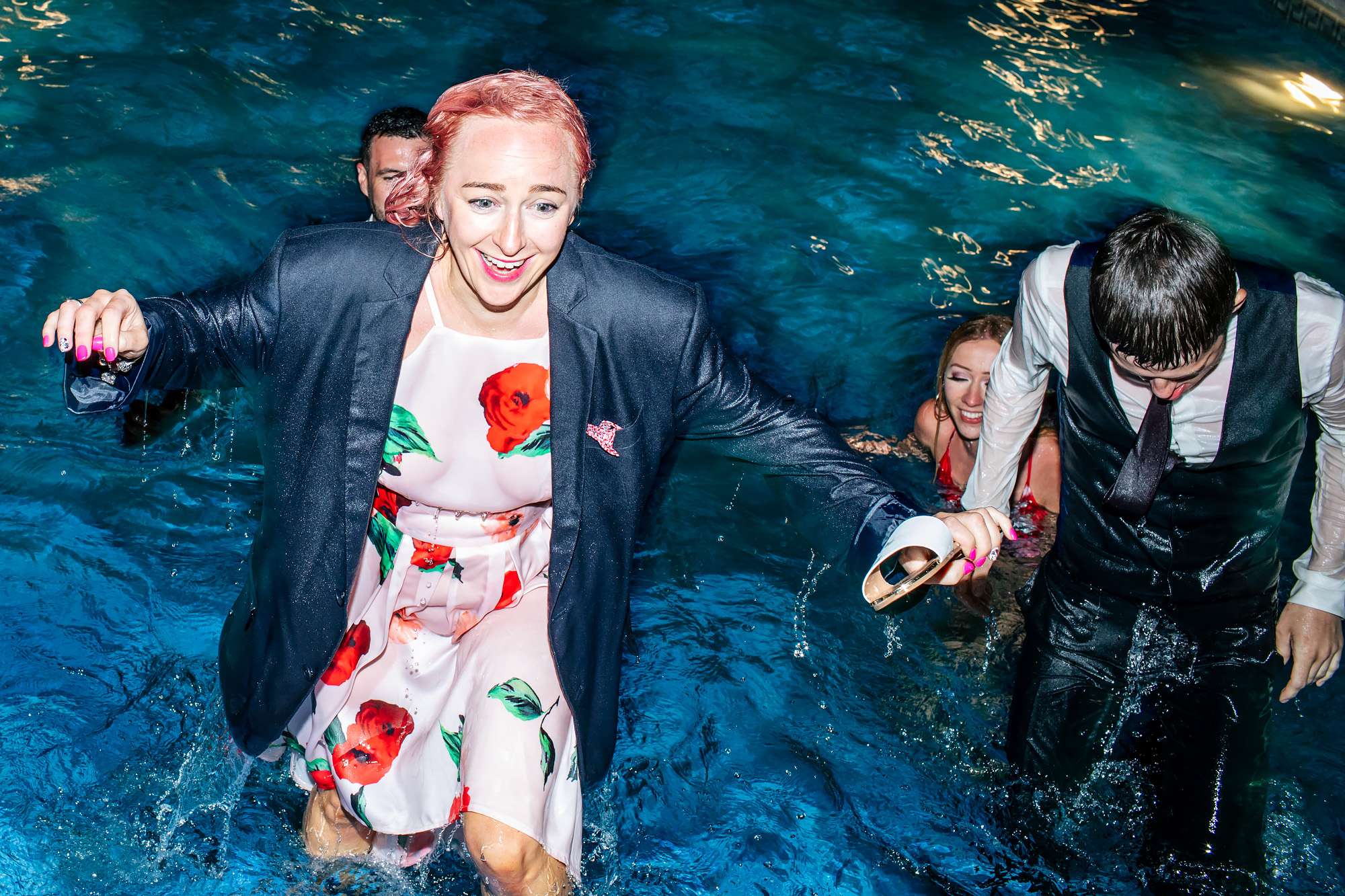 Wedding guests in the pool fully clothed