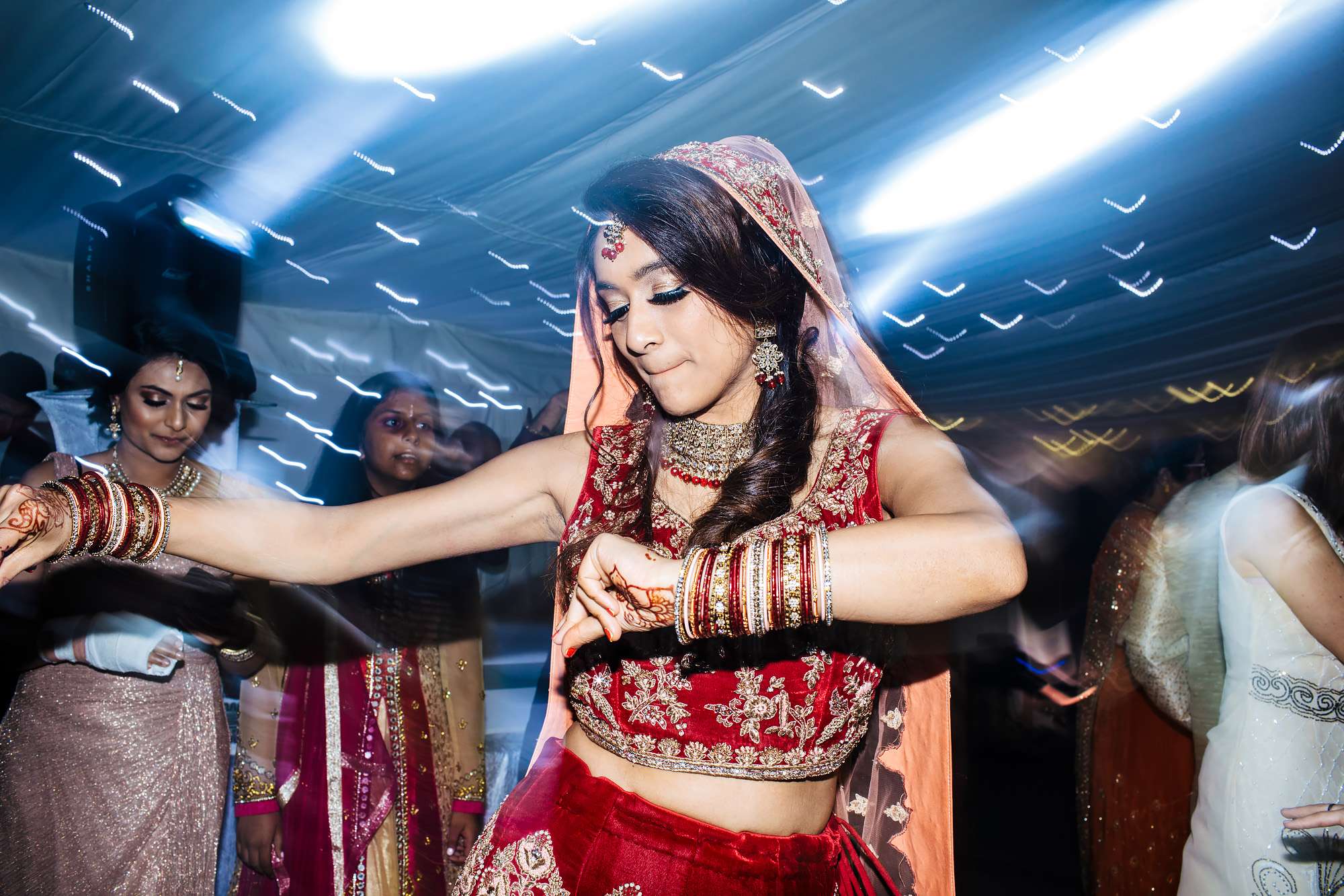 Asian bride dancing at her wedding