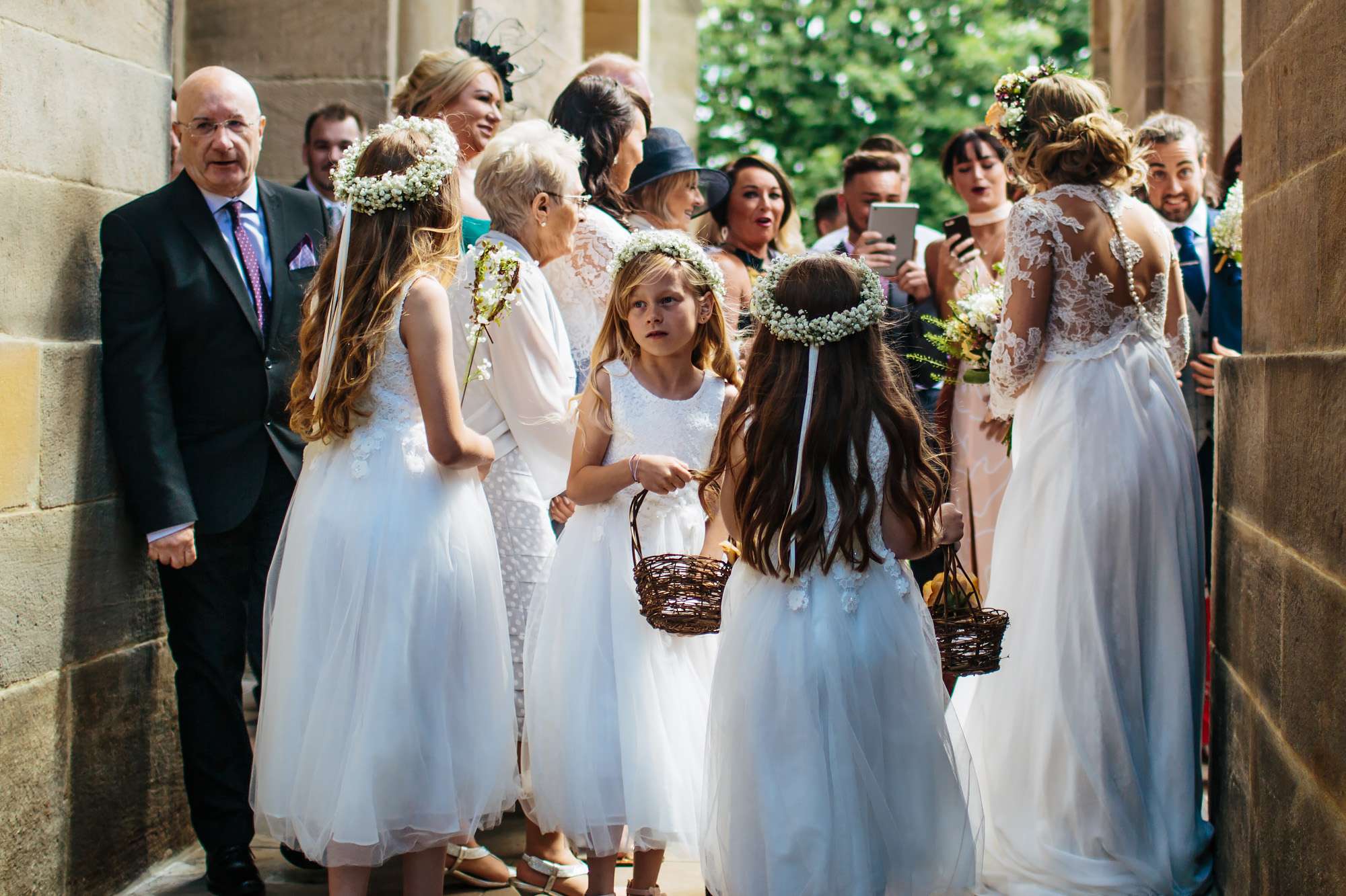 Bridesmaids outside a church wedding in Yorkshire