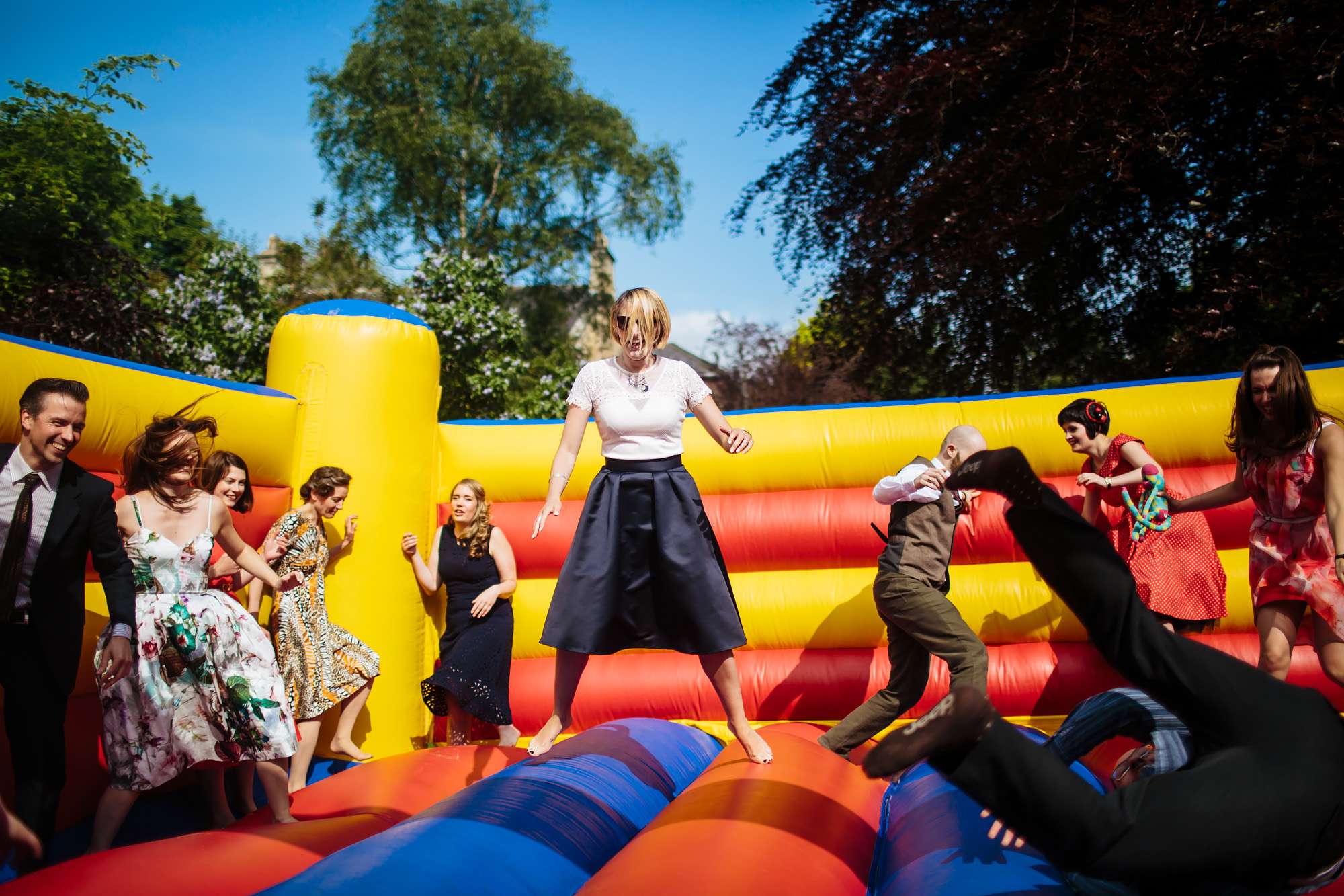 Wedding guests on a trampoline in Harrogate