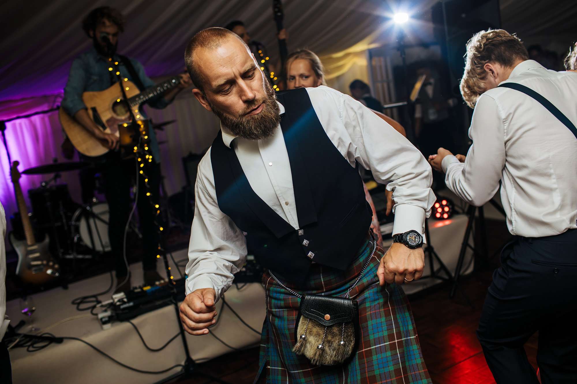 Guest in kilt dancing at a Yorkshire wedding