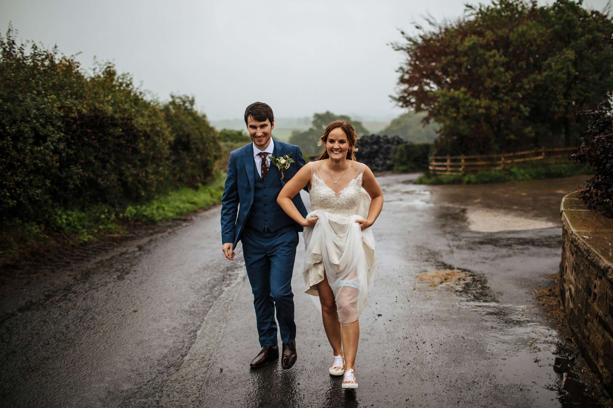 Bride and groom in the rain at a Harrogate wedding