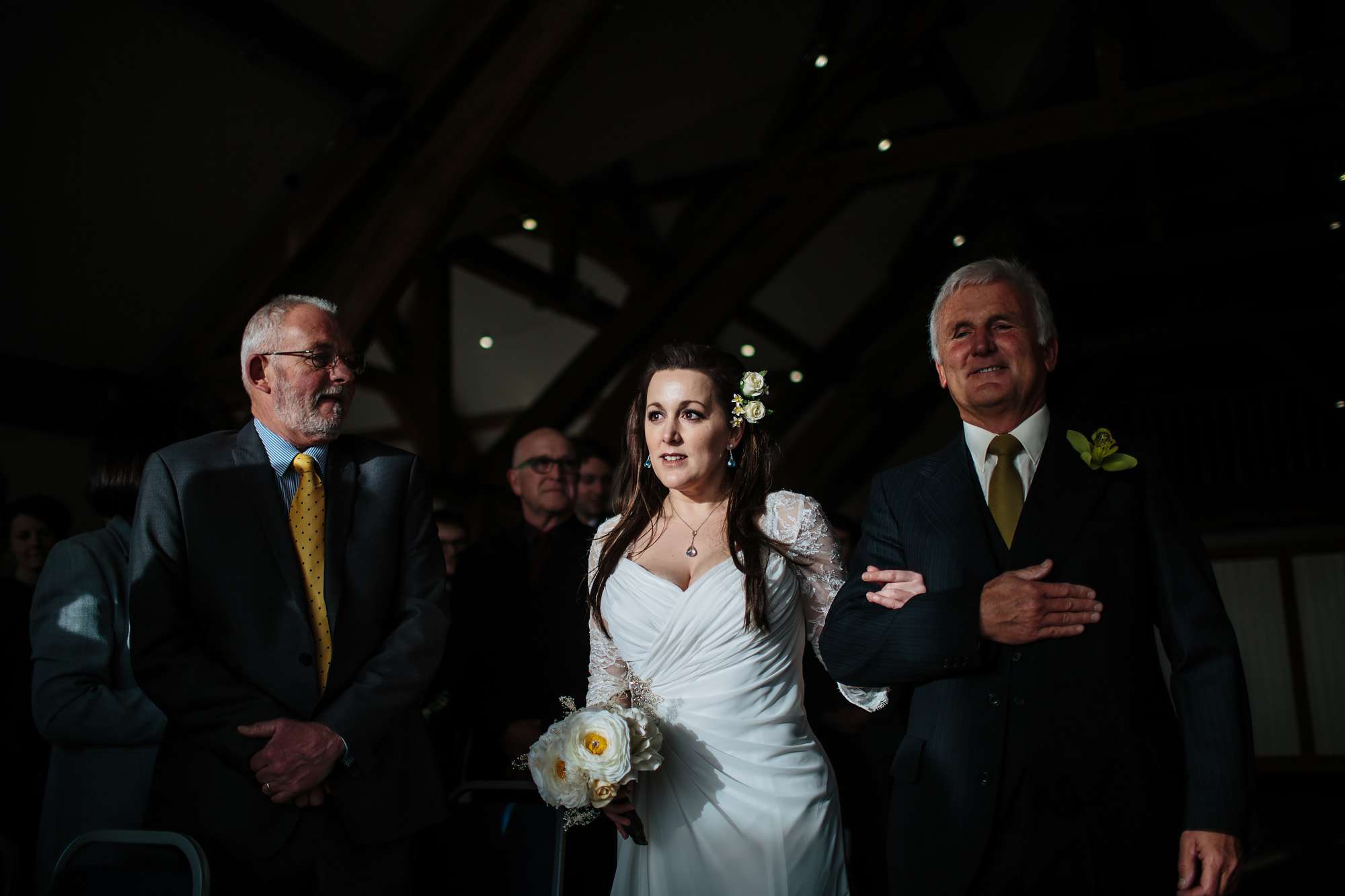 Bride and father walking down the aisle at her wedding