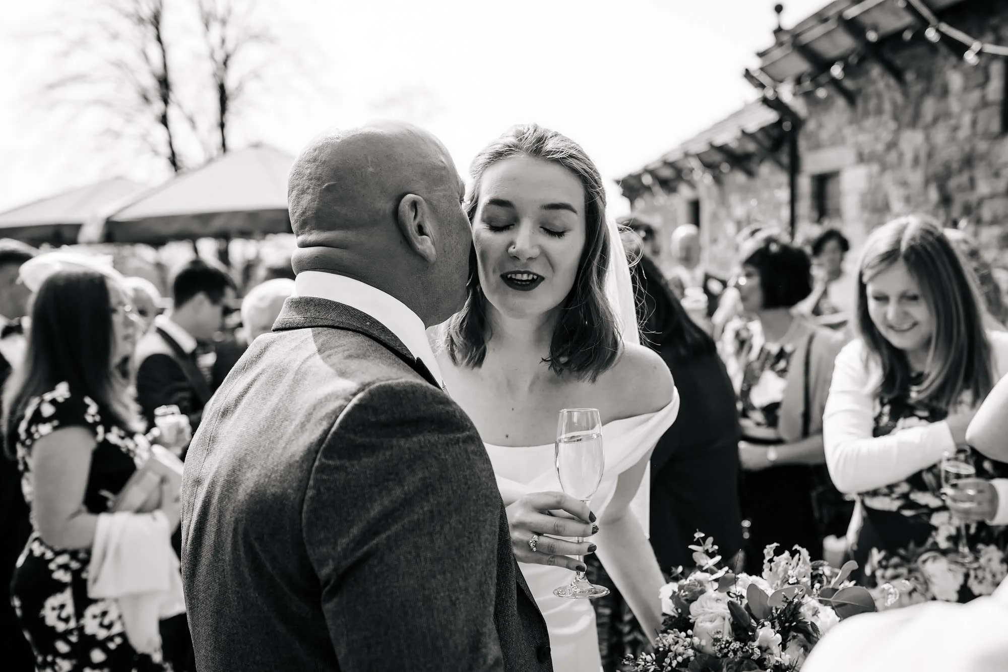 Bride kissing her father at her wedding at Browsholme Hall