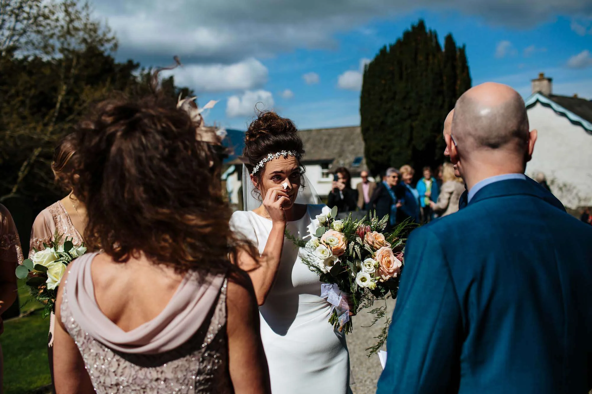 Bride cries before she enters the church